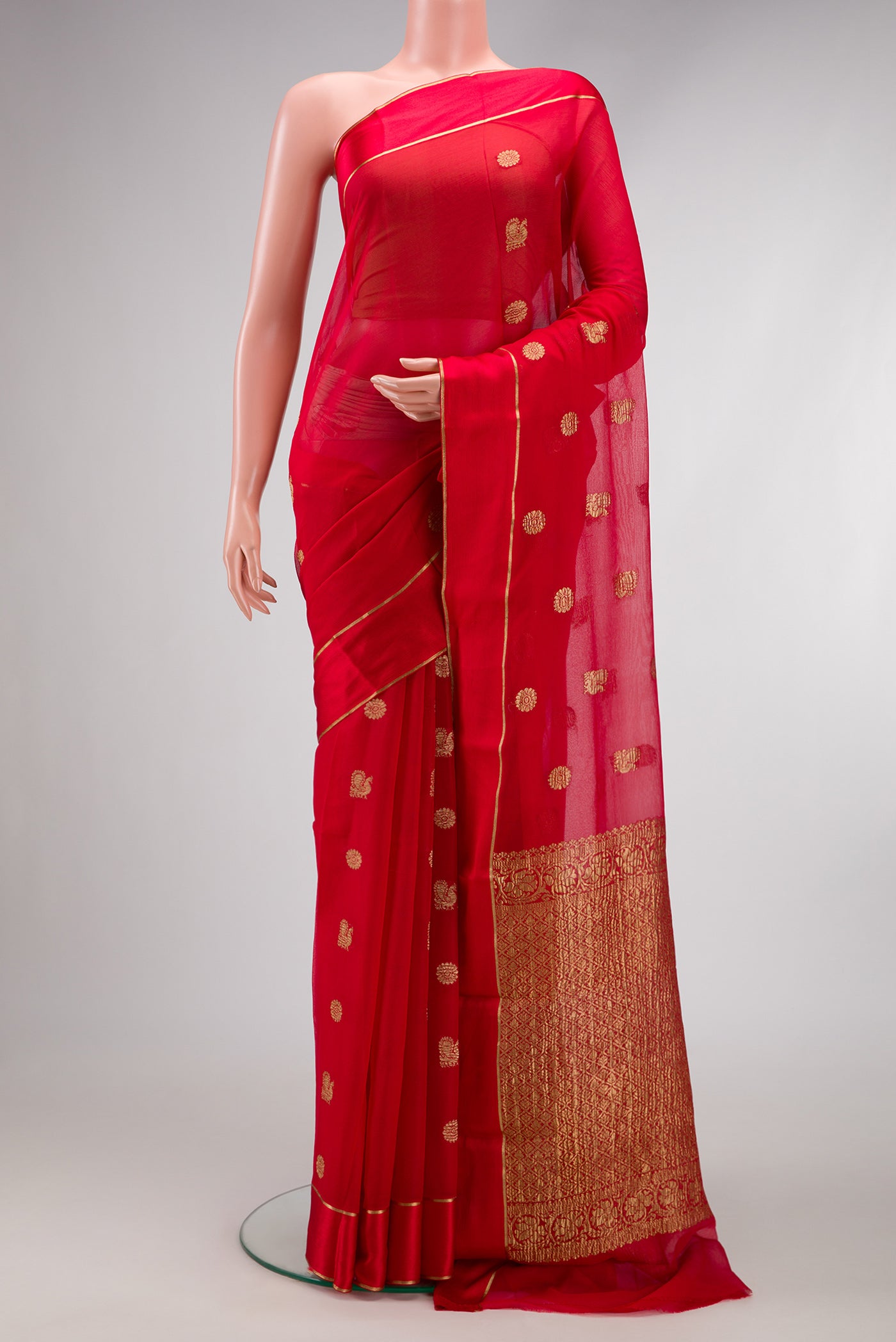 Red Dual Tone Mysore Georgette Saree with Zari Butta on the body and Plain Border.  displayed on a mannequin
