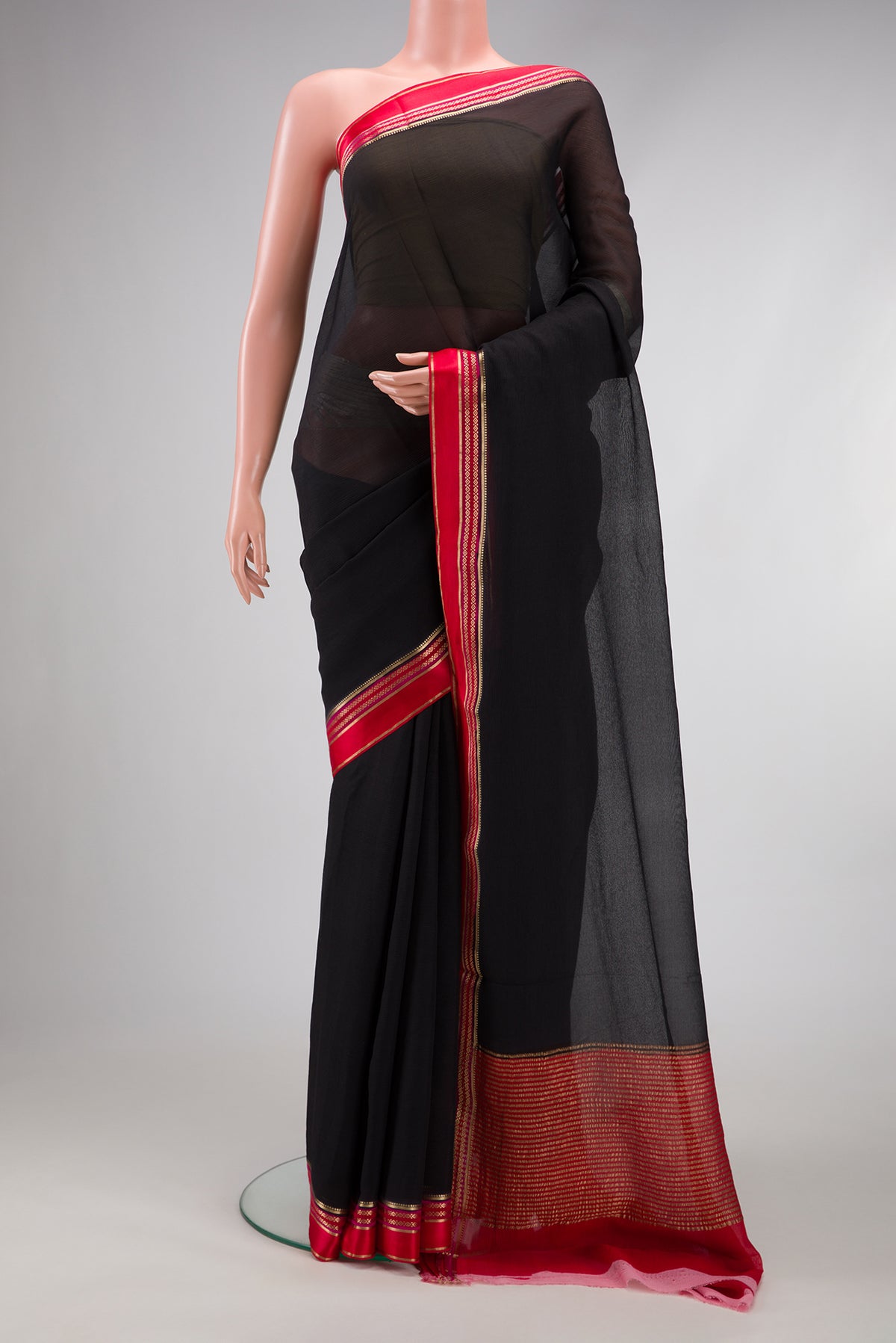Black Mysore Chiffon Saree with Plain Body and Zari And Thread Border.  displayed on a mannequin