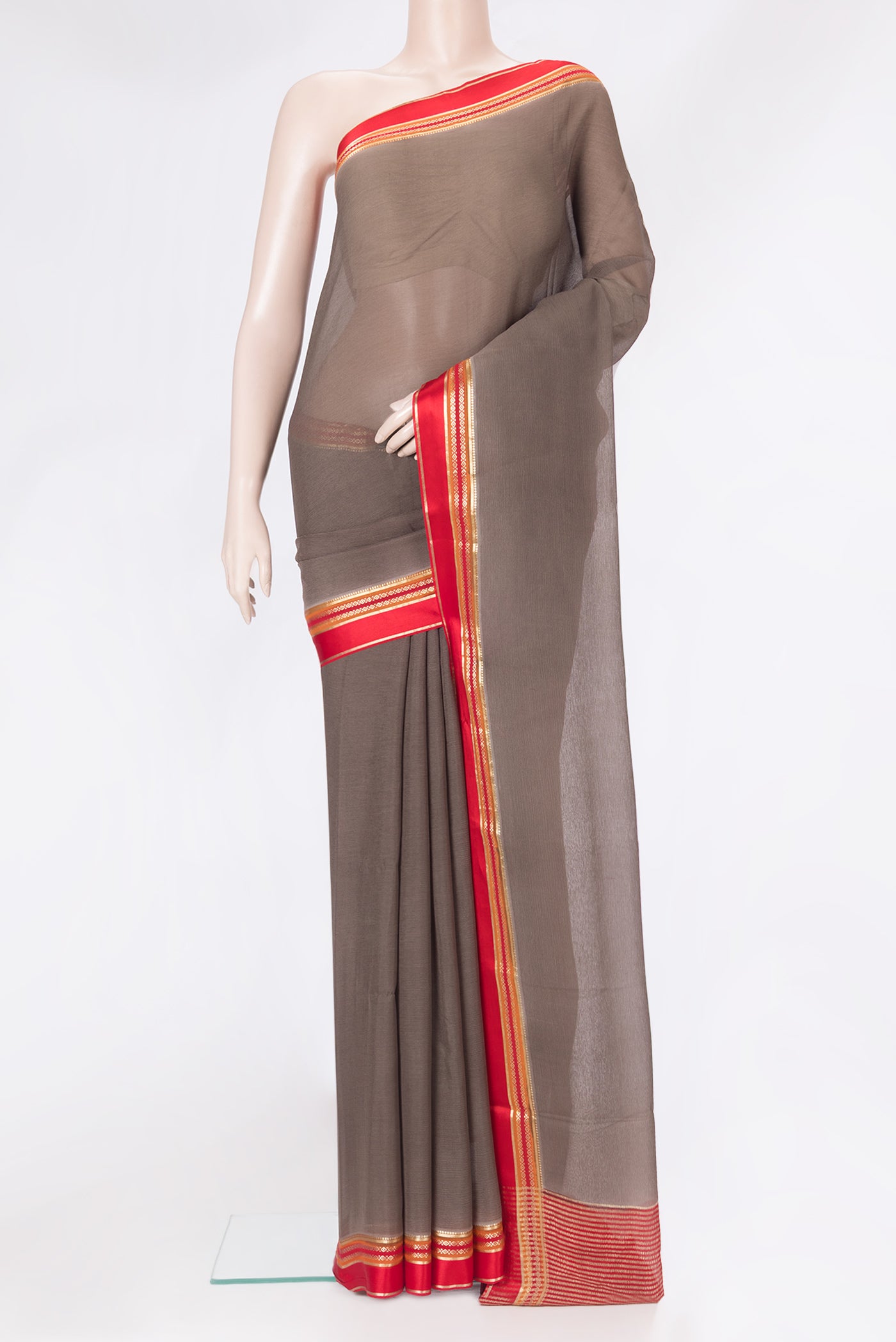 Brown Mysore Chiffon Saree with Plain Body and Zari Border.  displayed on a mannequin