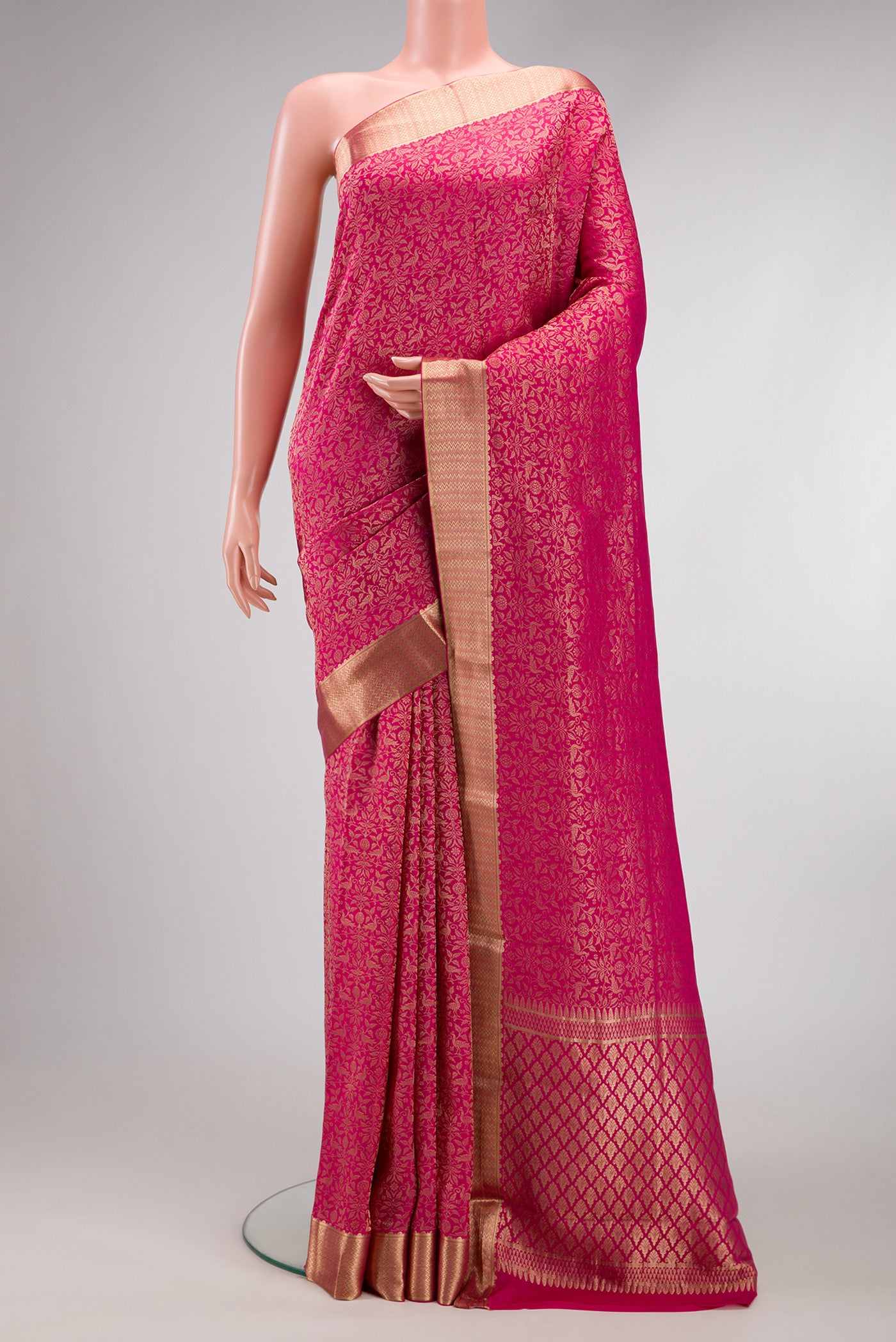 Beige and Off White Dual Tone Georgette Saree with Zari Brocade on the body and Zari Border.  displayed on a mannequin