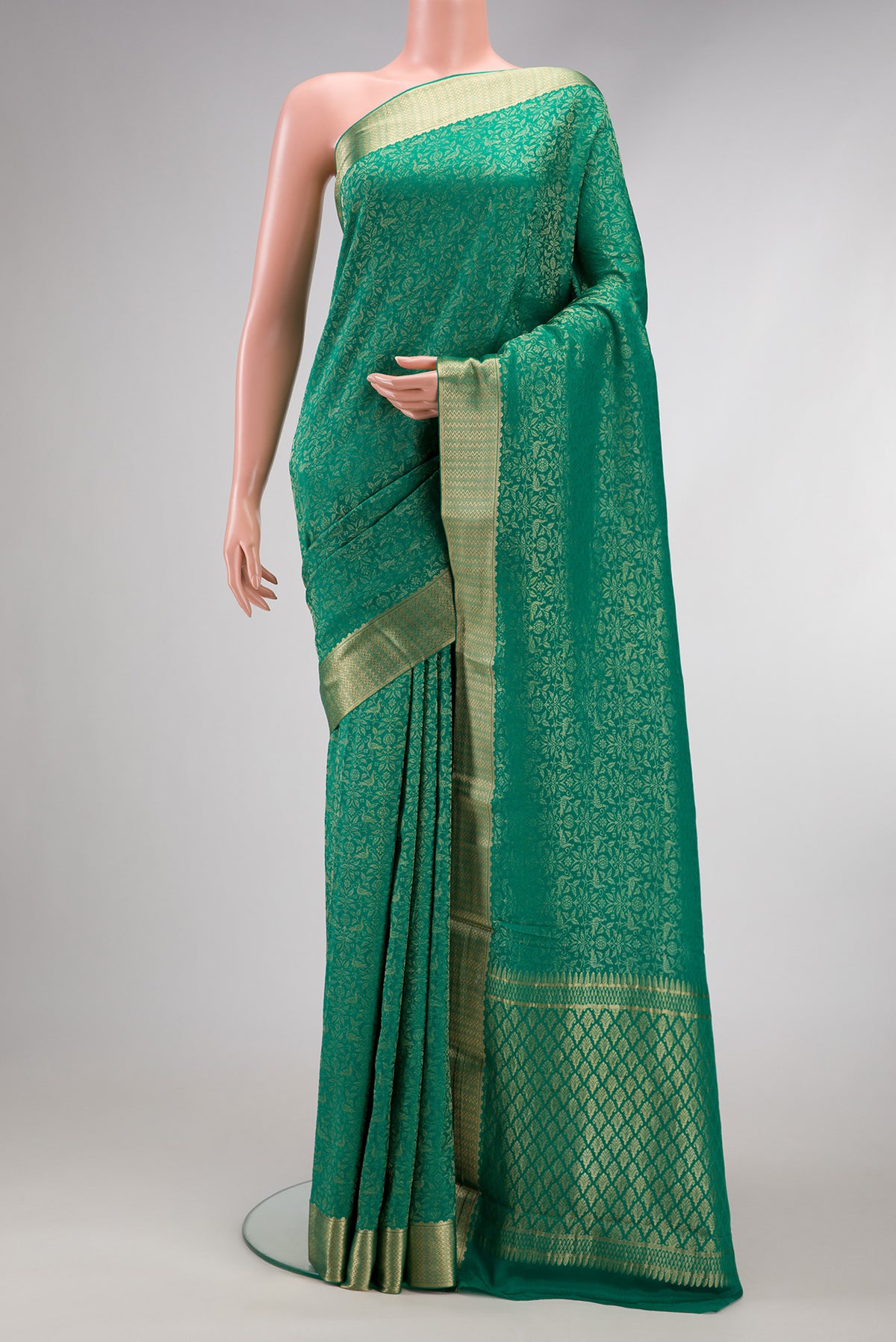 Beige and Off White Dual Tone Georgette Saree with Zari Brocade on the body and Zari Border.  displayed on a mannequin