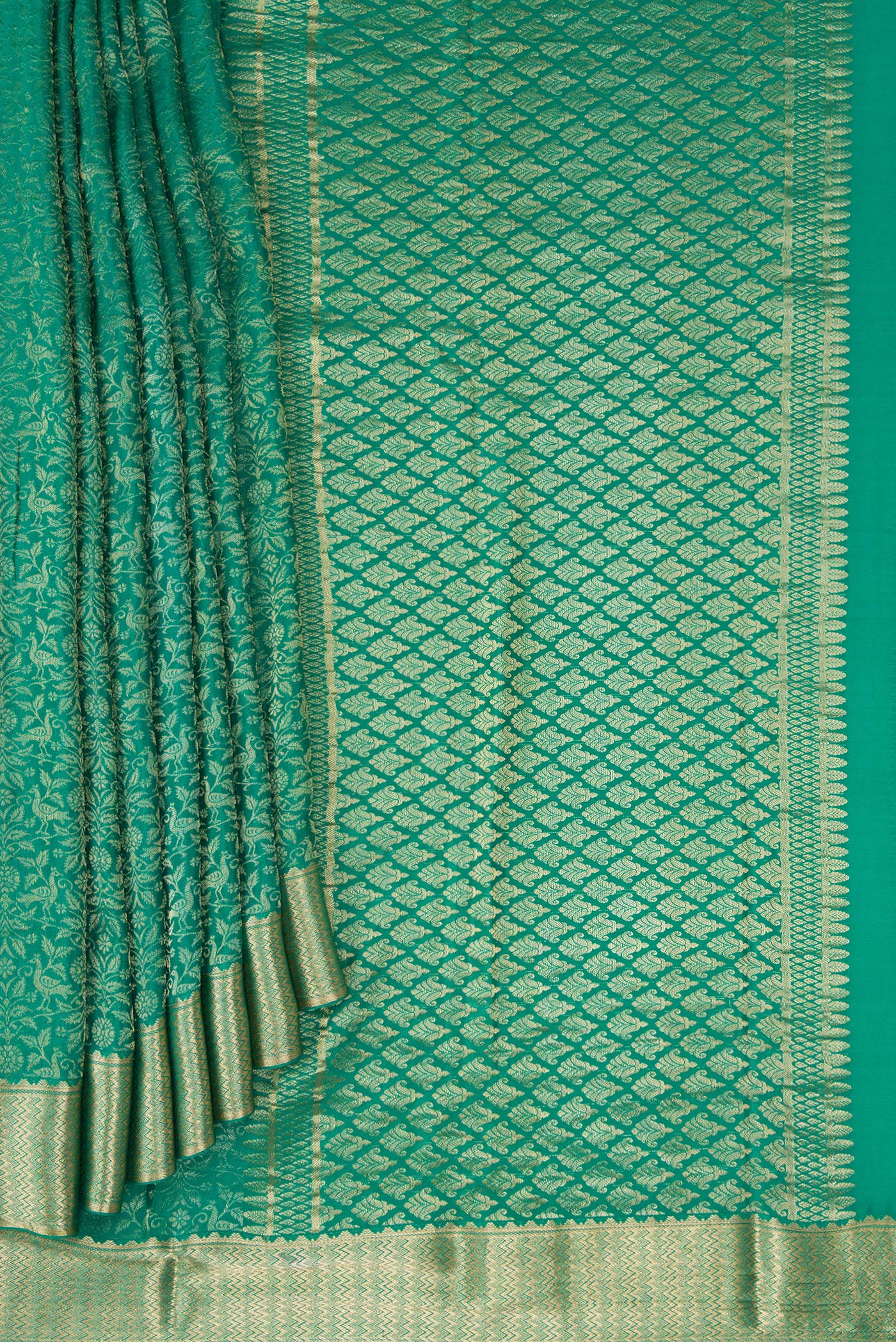 Pleats and pallu of Beige and Off White Dual Tone Georgette Saree with Zari Brocade on the body and Zari Border. 