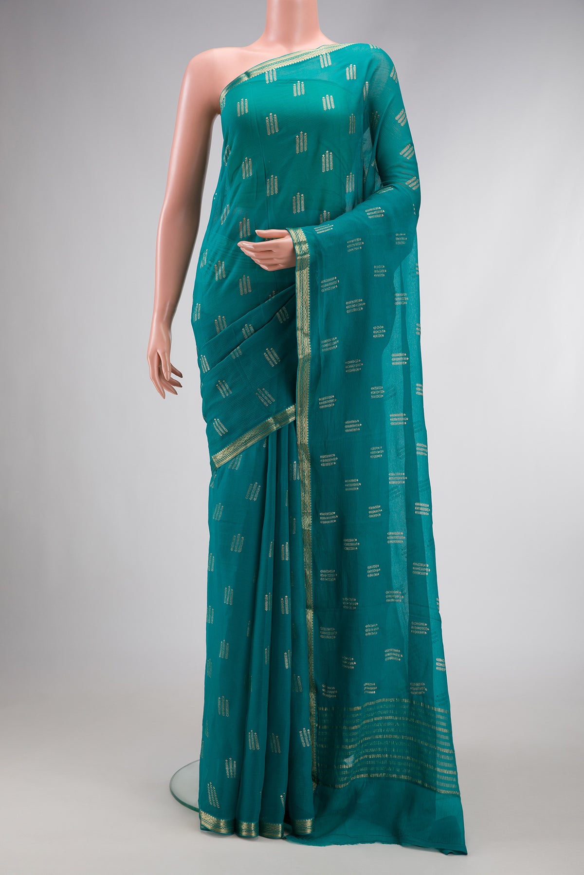 Peacock Blue Dual Tone Mysore Chiffon Saree with Zari Butta on the body and Zari Border.  displayed on a mannequin