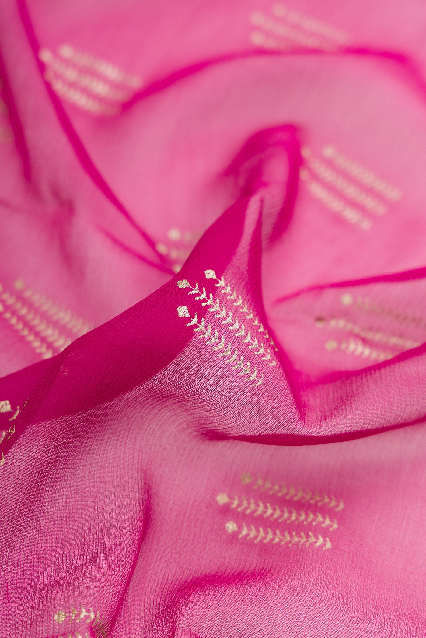Close up of Beige and Off White Dual Tone Mysore Chiffon Saree with Zari Butta on the body and Zari Border.  displaying folds