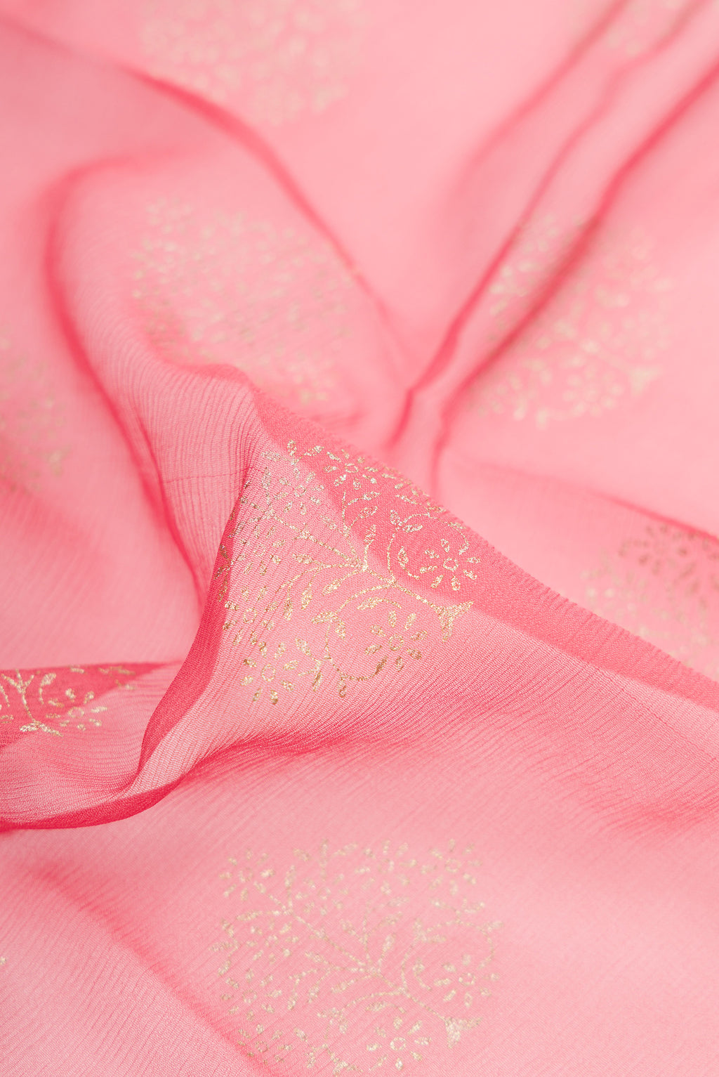 Close up of Pink Dual Tone Mysore Chiffon Saree with Zari Butta on the body and Zari Border.  displaying folds