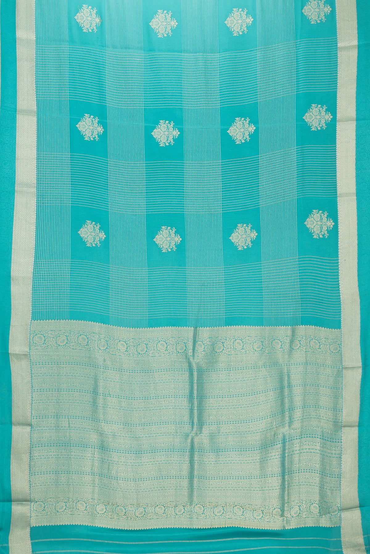 Flat view of Sky Blue Dual Tone Mysore Crepe Saree with Checked design on the body and Zari And Thread Border. 