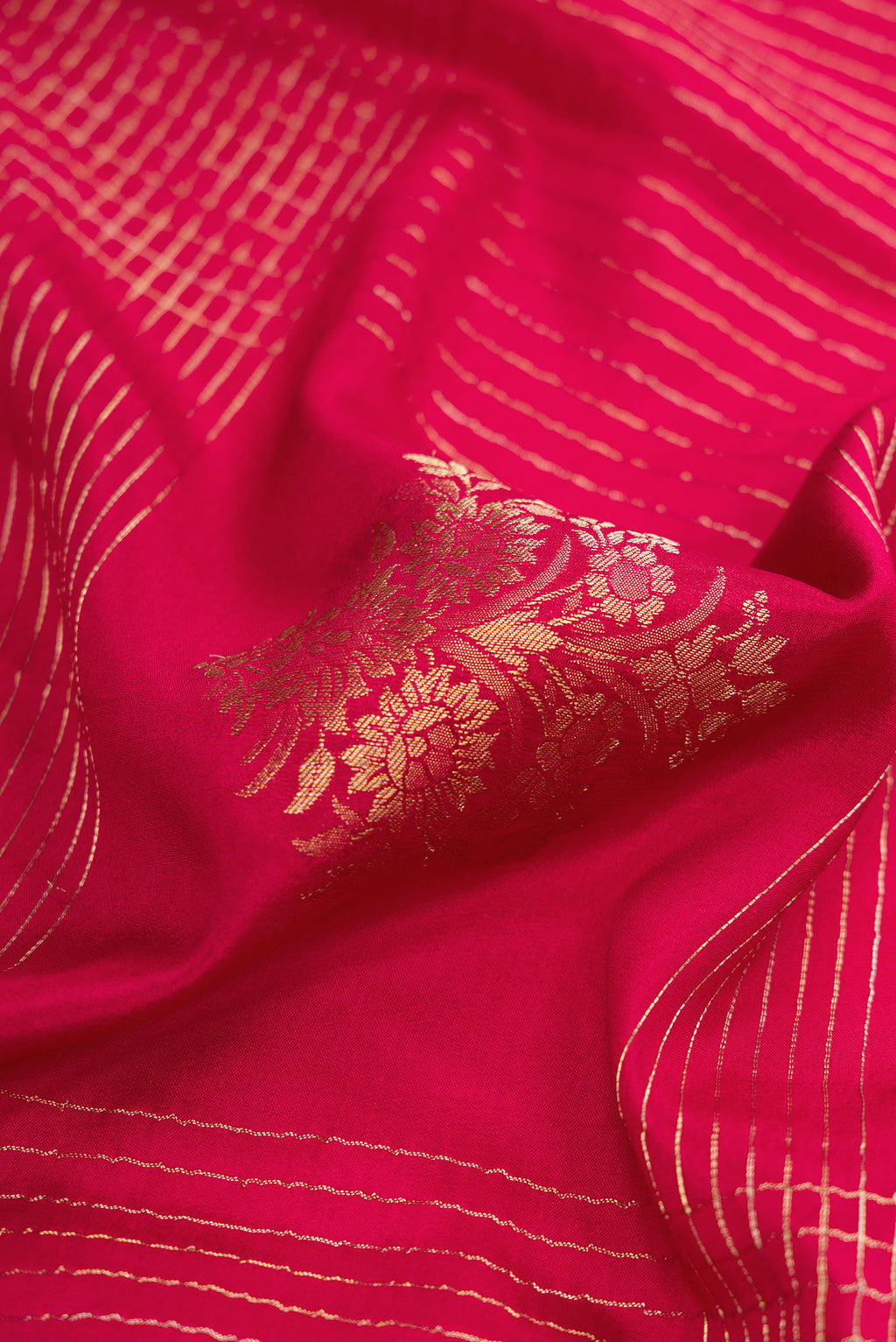 Close up of Red Dual Tone Mysore Crepe Saree with Checked design on the body and Zari Border.  displaying folds