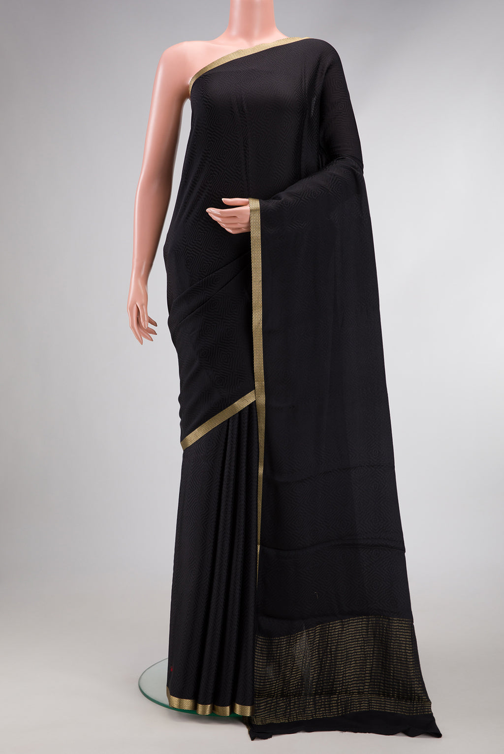 Black Dual Tone Mysore Georgette Saree with Jacquard design on the body and Zari Border.  displayed on a mannequin