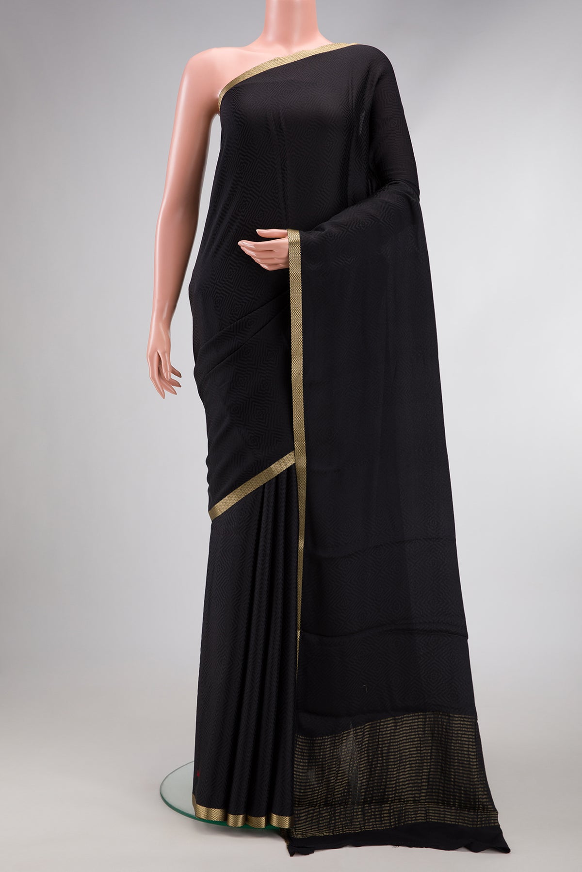 Black Dual Tone Mysore Georgette Saree with Jacquard design on the body and Zari Border.  displayed on a mannequin