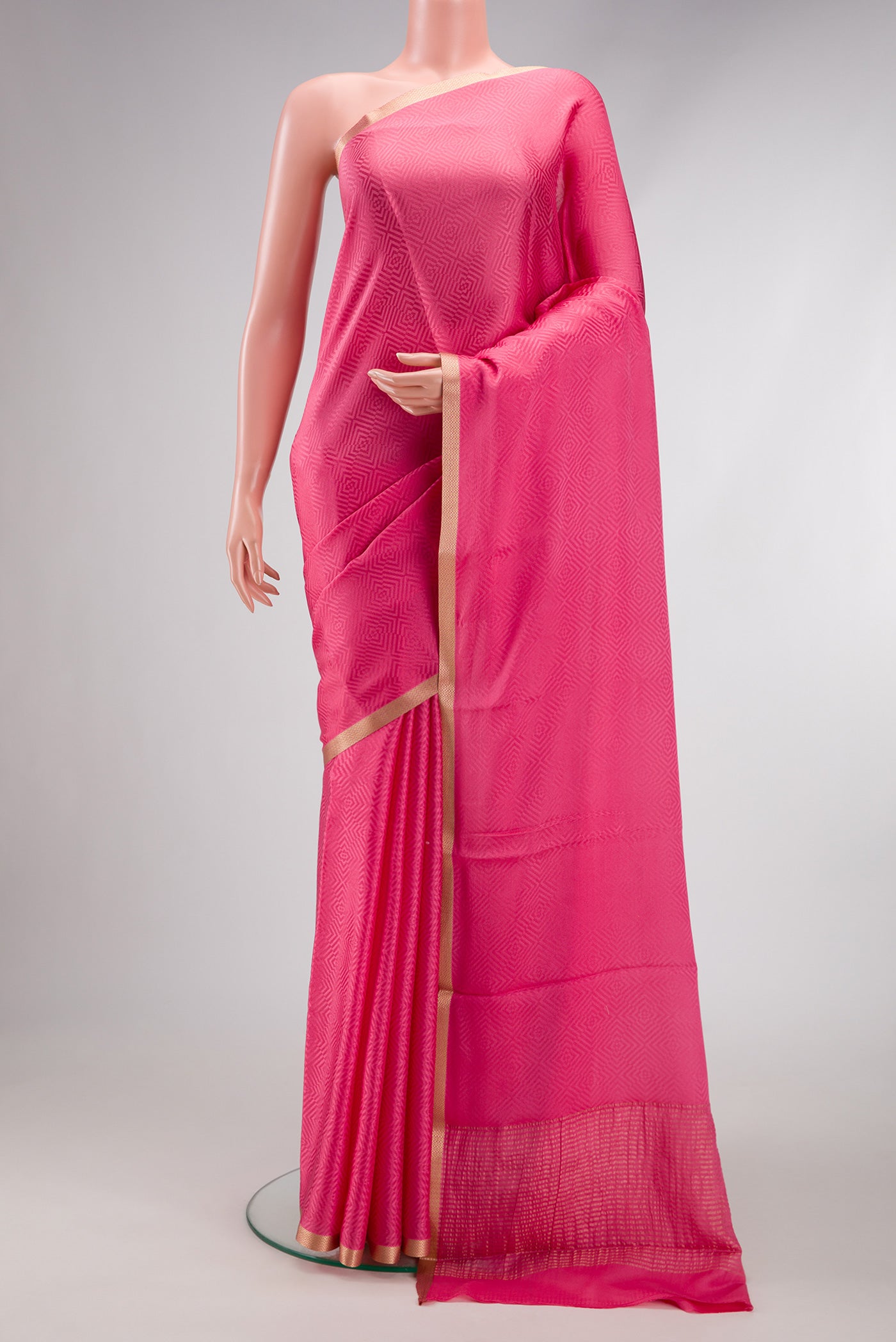 Pink Dual Tone Georgette Saree with Jacquard design on the body and Zari Border.  displayed on a mannequin