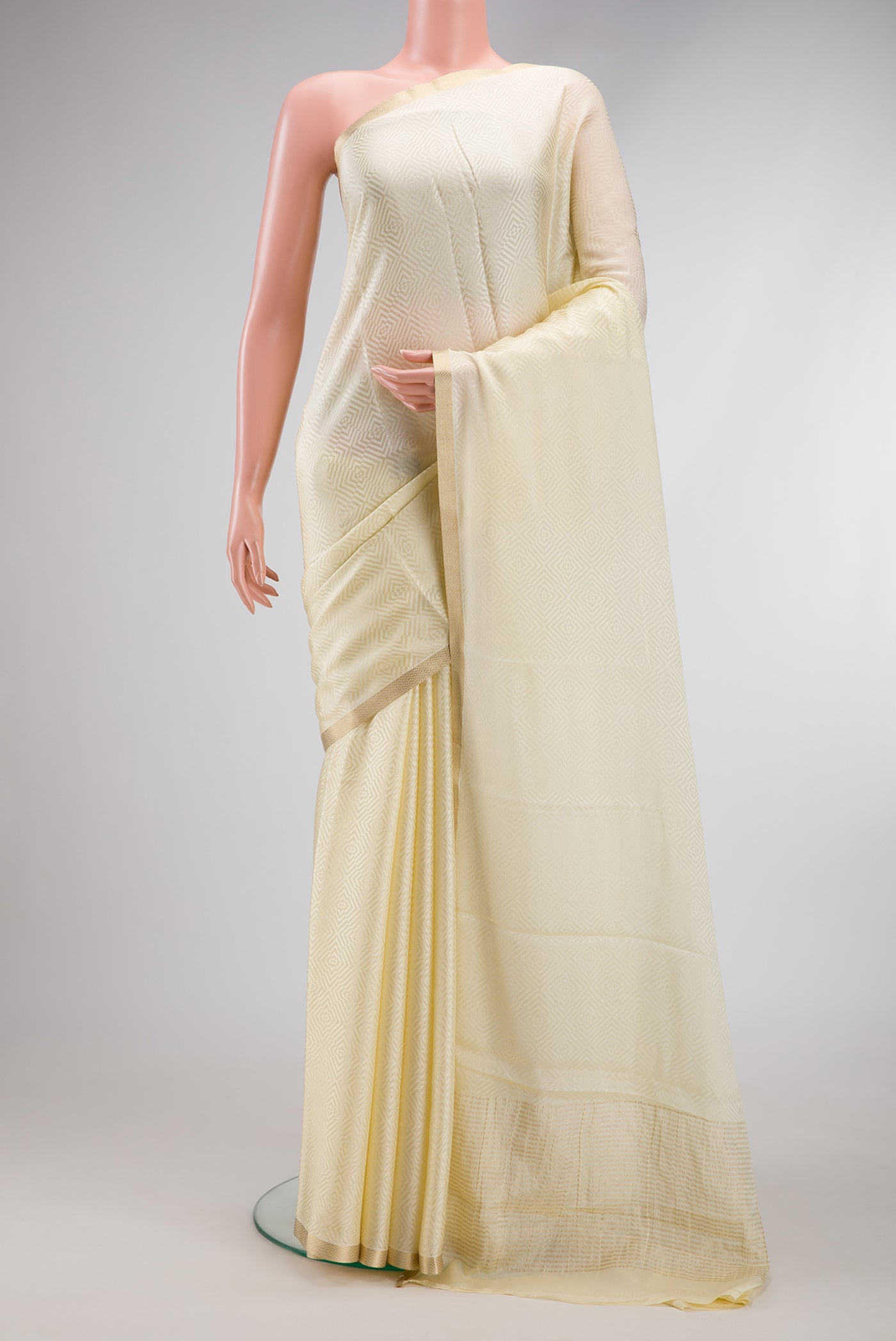Cream Dual Tone Banarasi Georgette Saree with Jacquard design on the body and Zari Border.  displayed on a mannequin