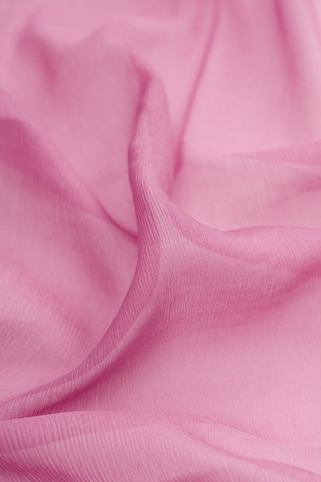 Close up of Lavender Chiffon Saree with Plain Body and Zari Border.  displaying folds