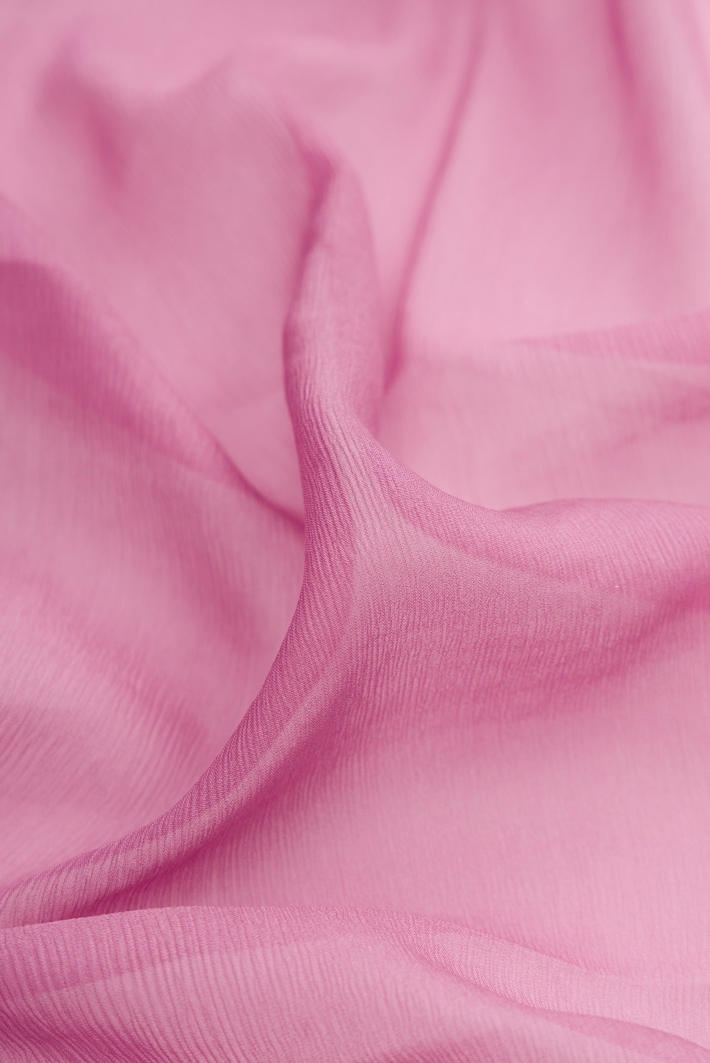 Close up of Lavender Chiffon Saree with Plain Body and Zari Border.  displaying folds