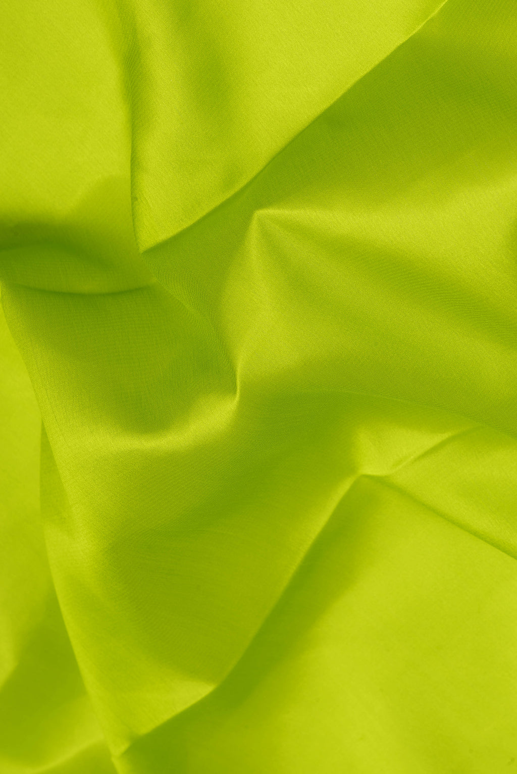 Close up of Parrot Green Mysore Silk Saree with Plain Body and Zari Border.  displaying folds