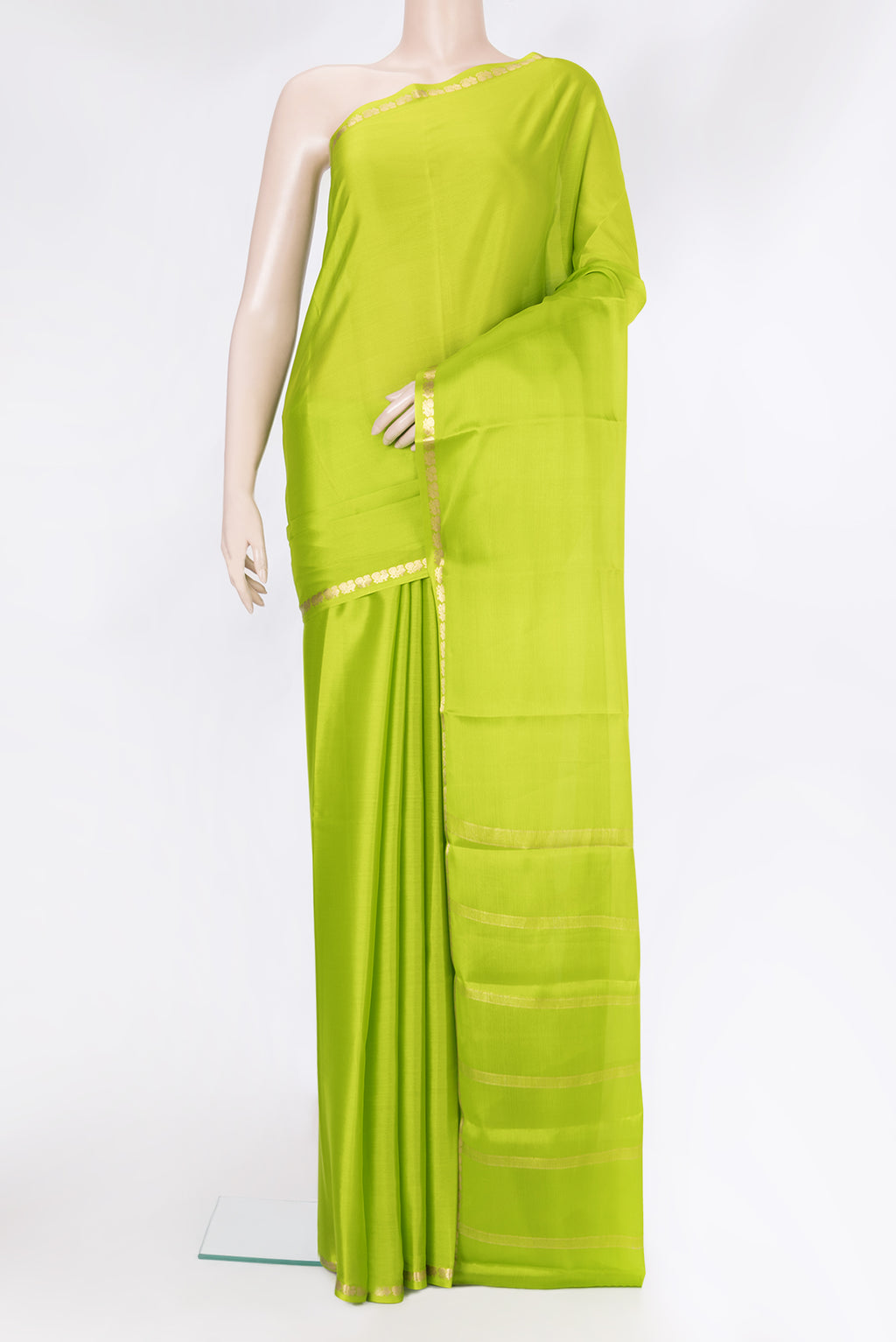 Parrot Green Mysore Silk Saree with Plain Body and Zari Border.  displayed on a mannequin
