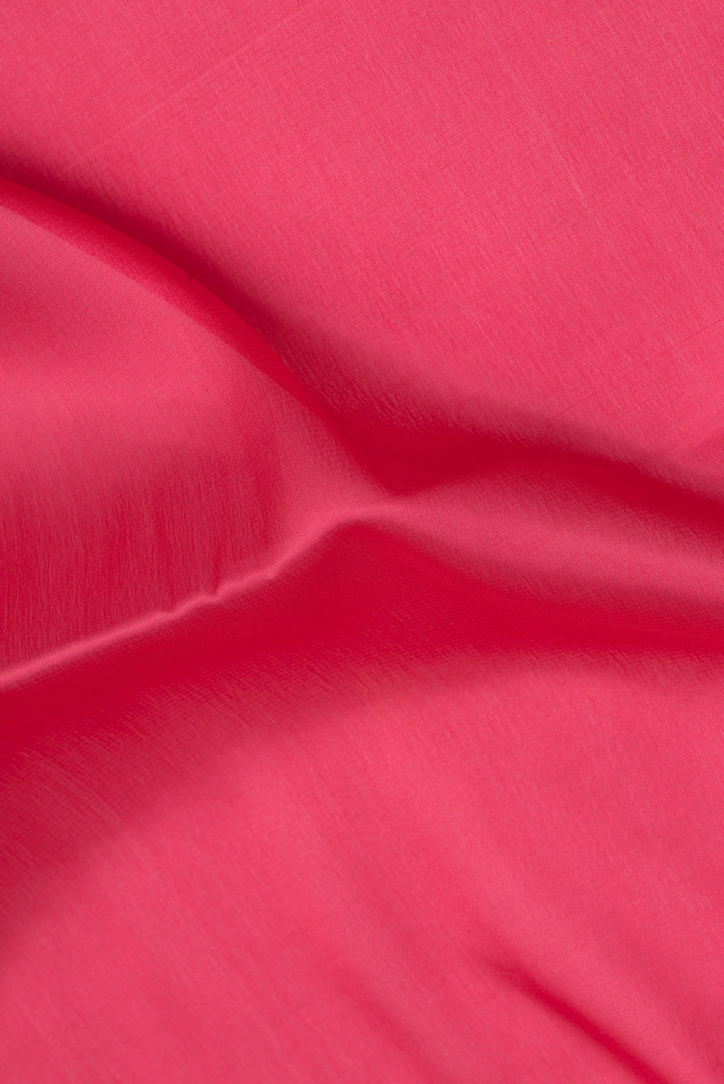 Close up of Imperial Red Mysore Silk Saree with Plain Body and Zari Border.  displaying folds