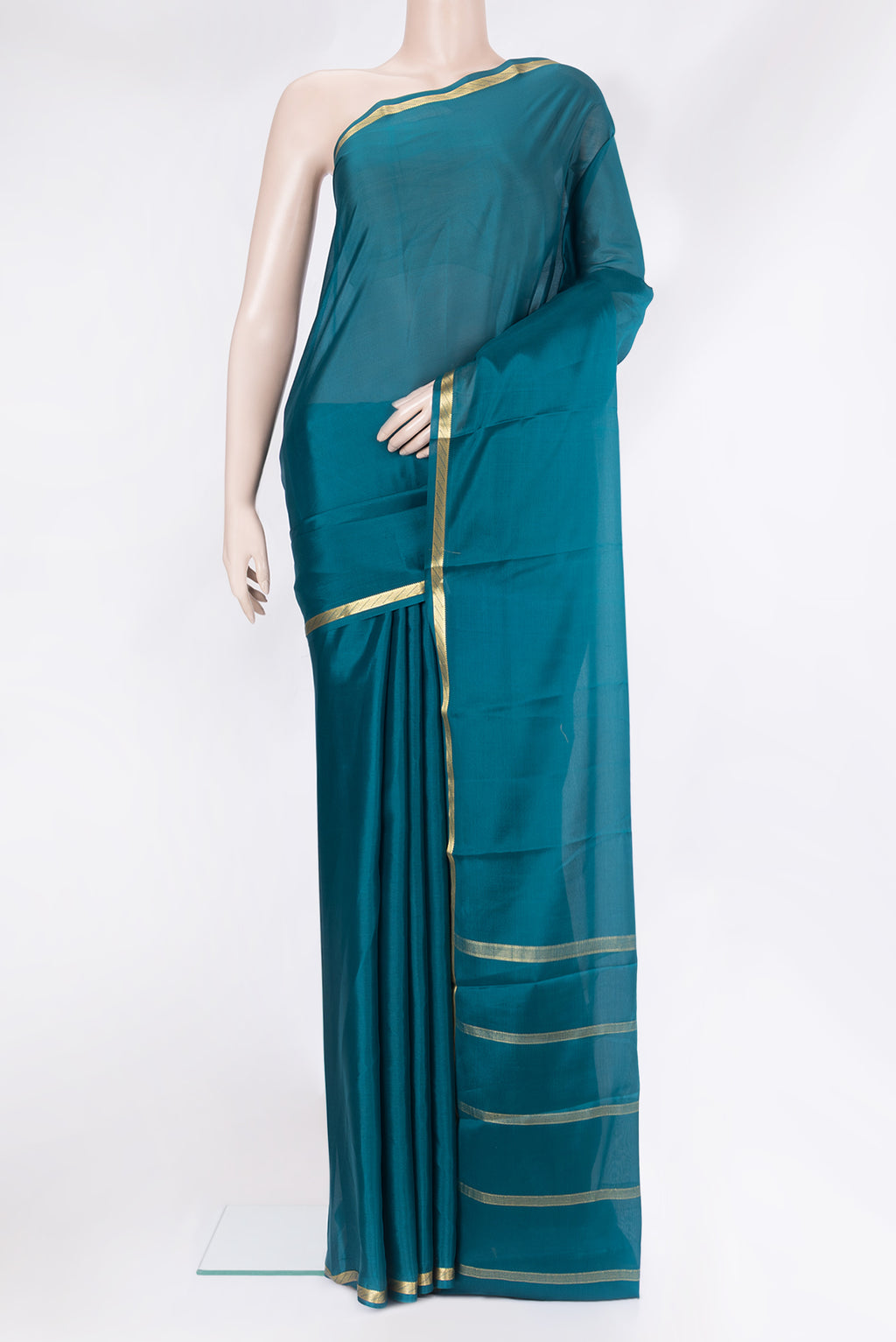 Peacock Blue Mysore Silk Saree with Plain Body and Zari Border.  displayed on a mannequin