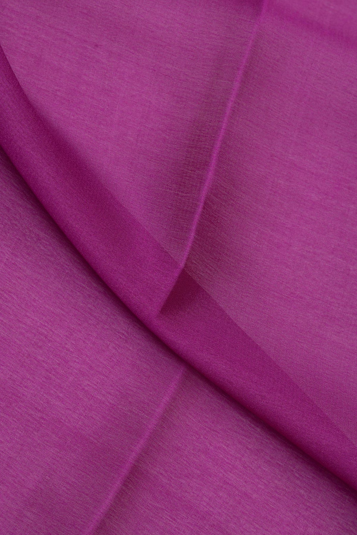 Close up of Purple Mysore Crepe Saree with Plain Body and Zari Border.  displaying folds