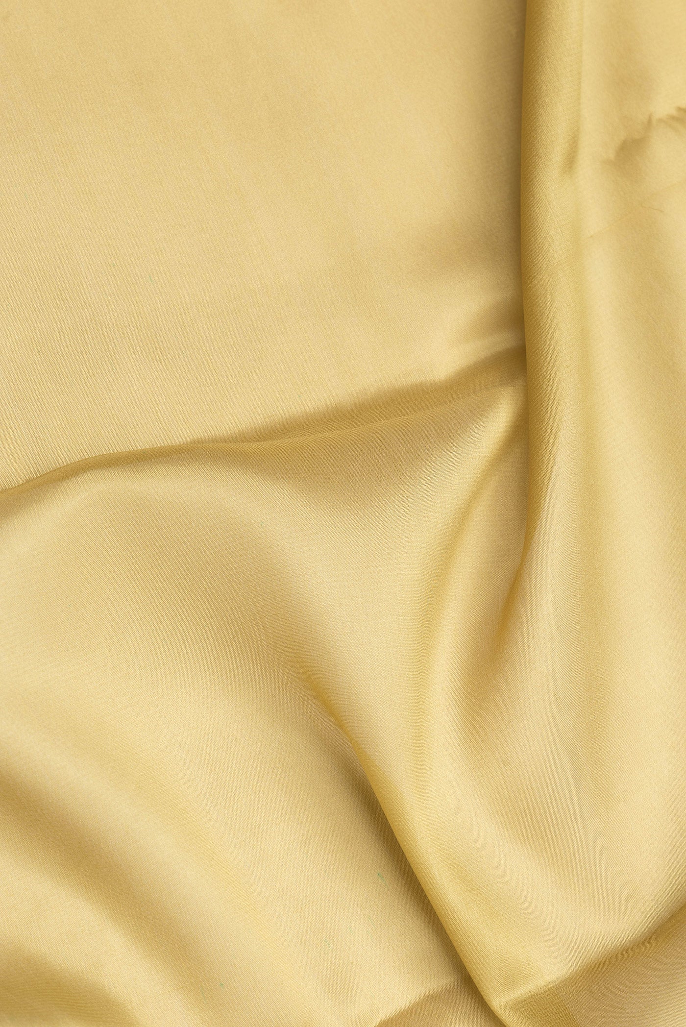 Close up of Sandal Dual Tone Mysore Crepe Saree with Plain Body and Zari Border.  displaying folds