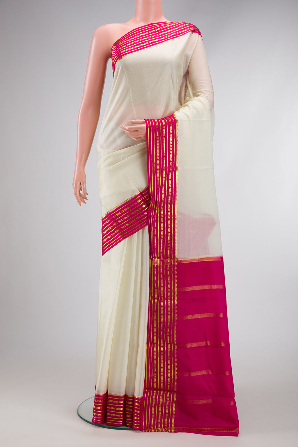 Off White Dual Tone Mysore Silk Saree with Plain Body and Zari Border.  displayed on a mannequin