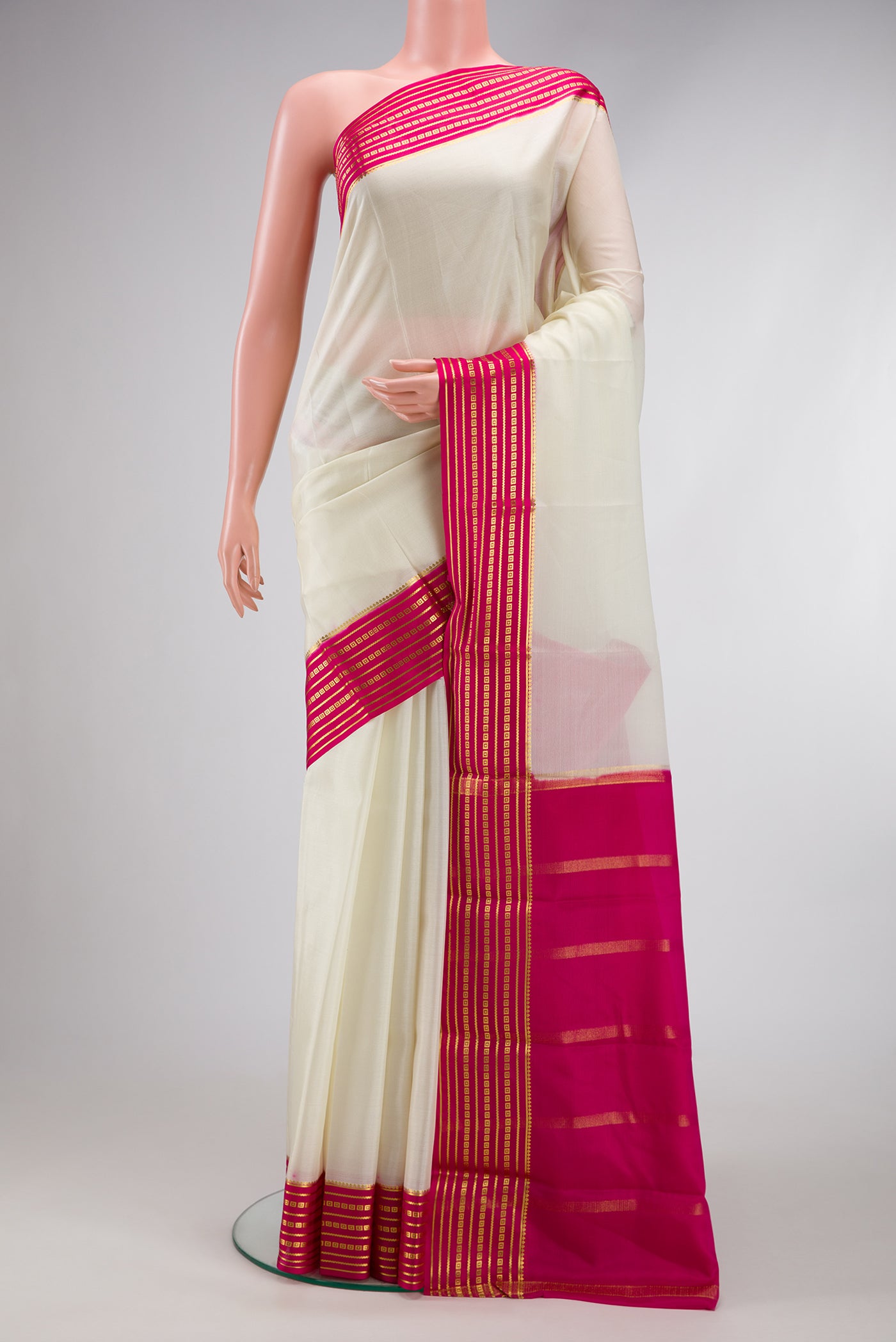 Off White Dual Tone Mysore Silk Saree with Plain Body and Zari Border.  displayed on a mannequin
