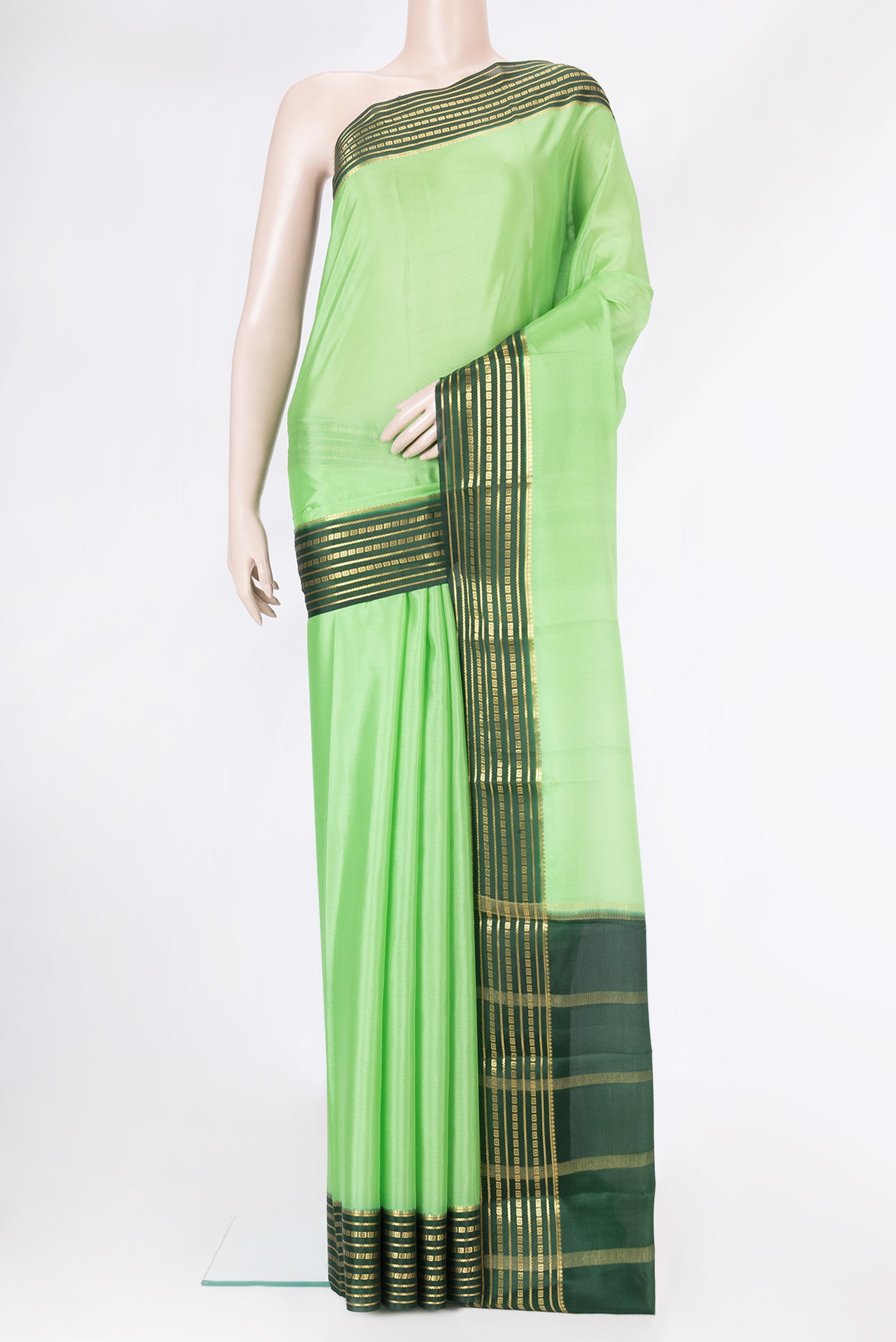 Parrot Green Dual Tone Mysore Silk Saree with Plain Body and Zari Border.  displayed on a mannequin