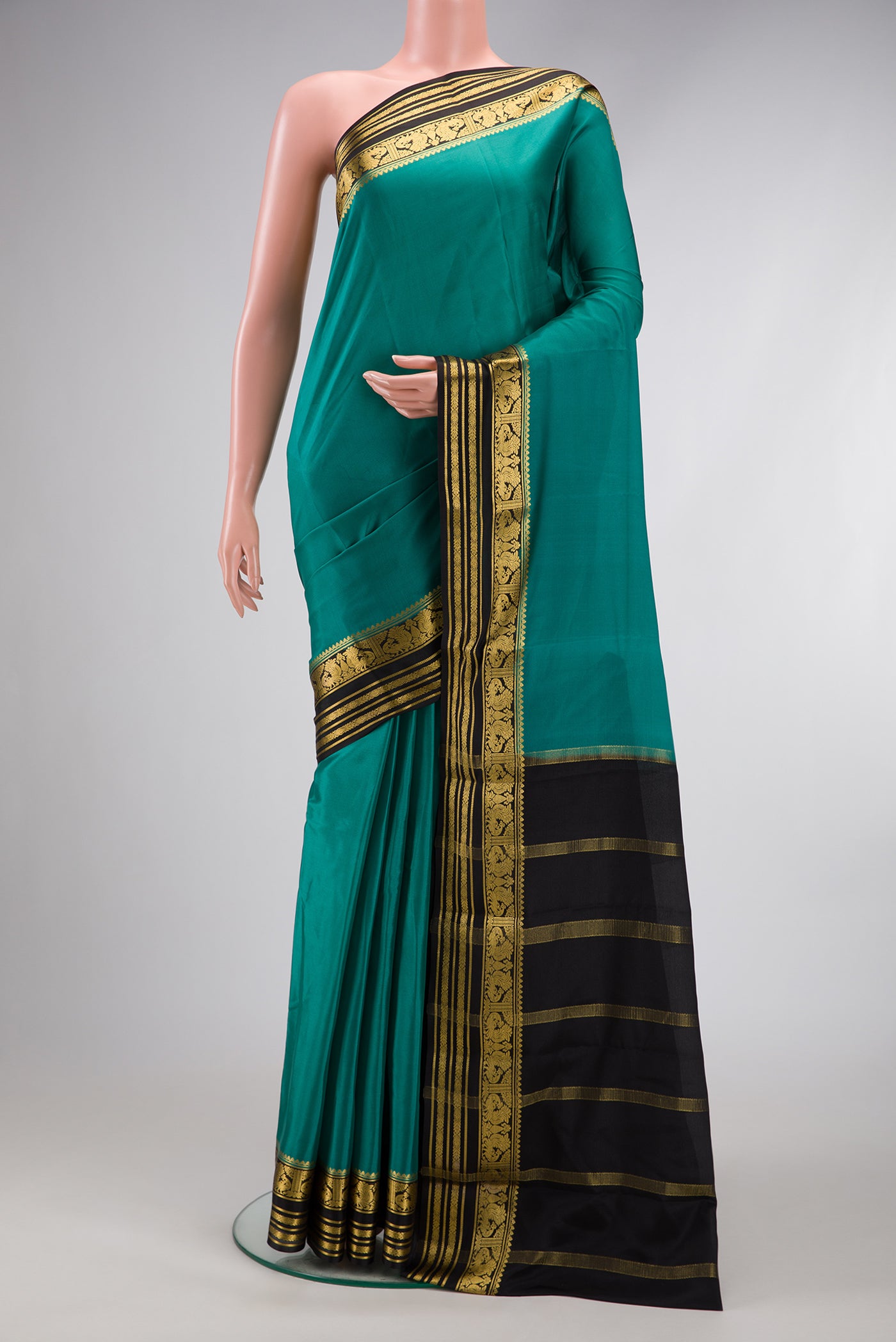 Green Dual Tone Mysore Silk Saree with Plain Body and Zari Border.  displayed on a mannequin