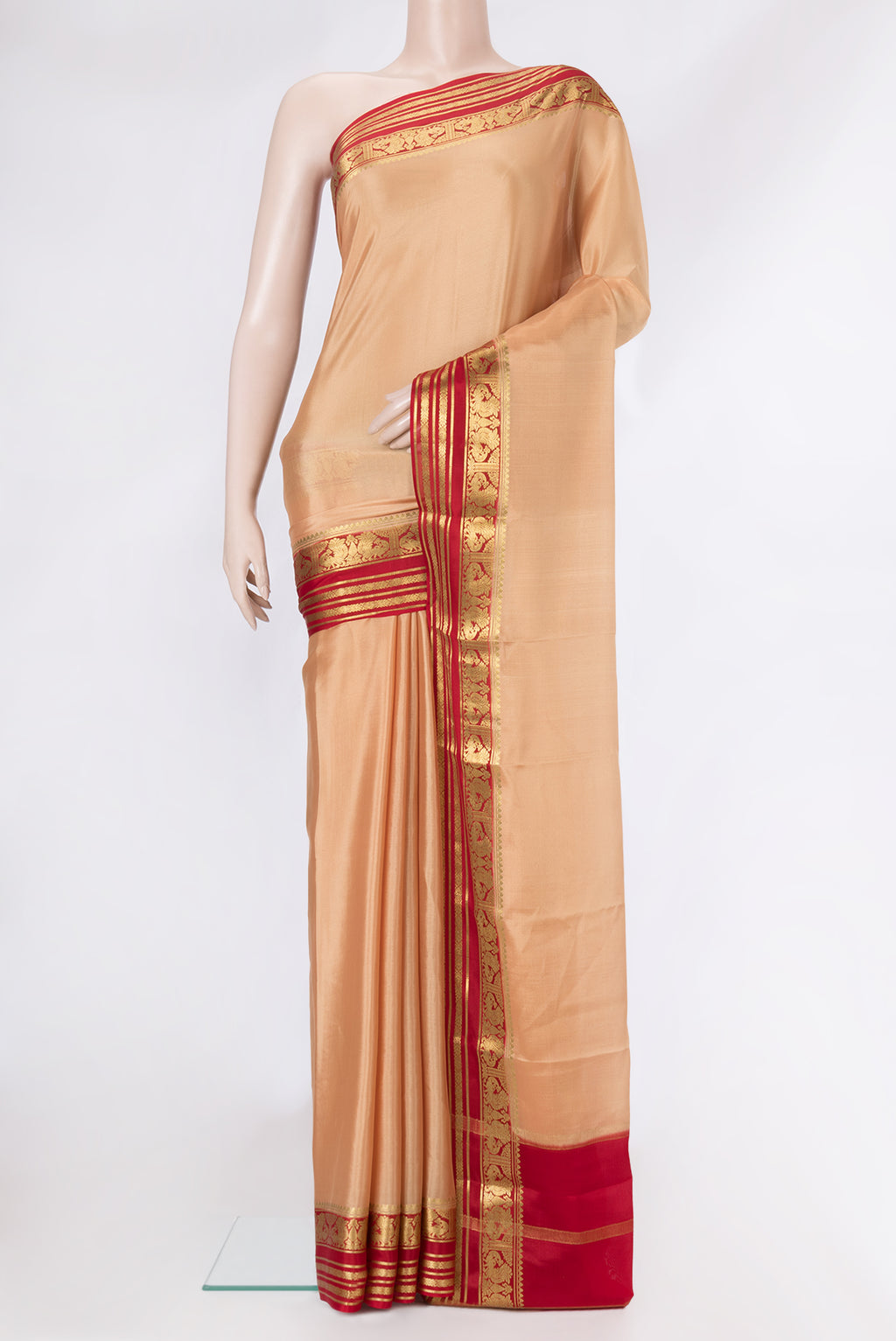 Sandal Mysore Crepe Saree with Plain Body and Zari Border.  displayed on a mannequin