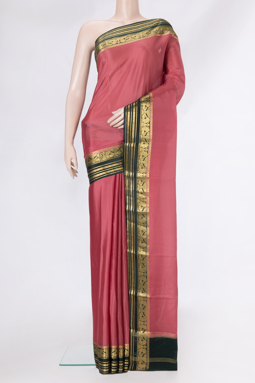 Coral Mysore Crepe Saree with Plain Body and Zari Border.  displayed on a mannequin