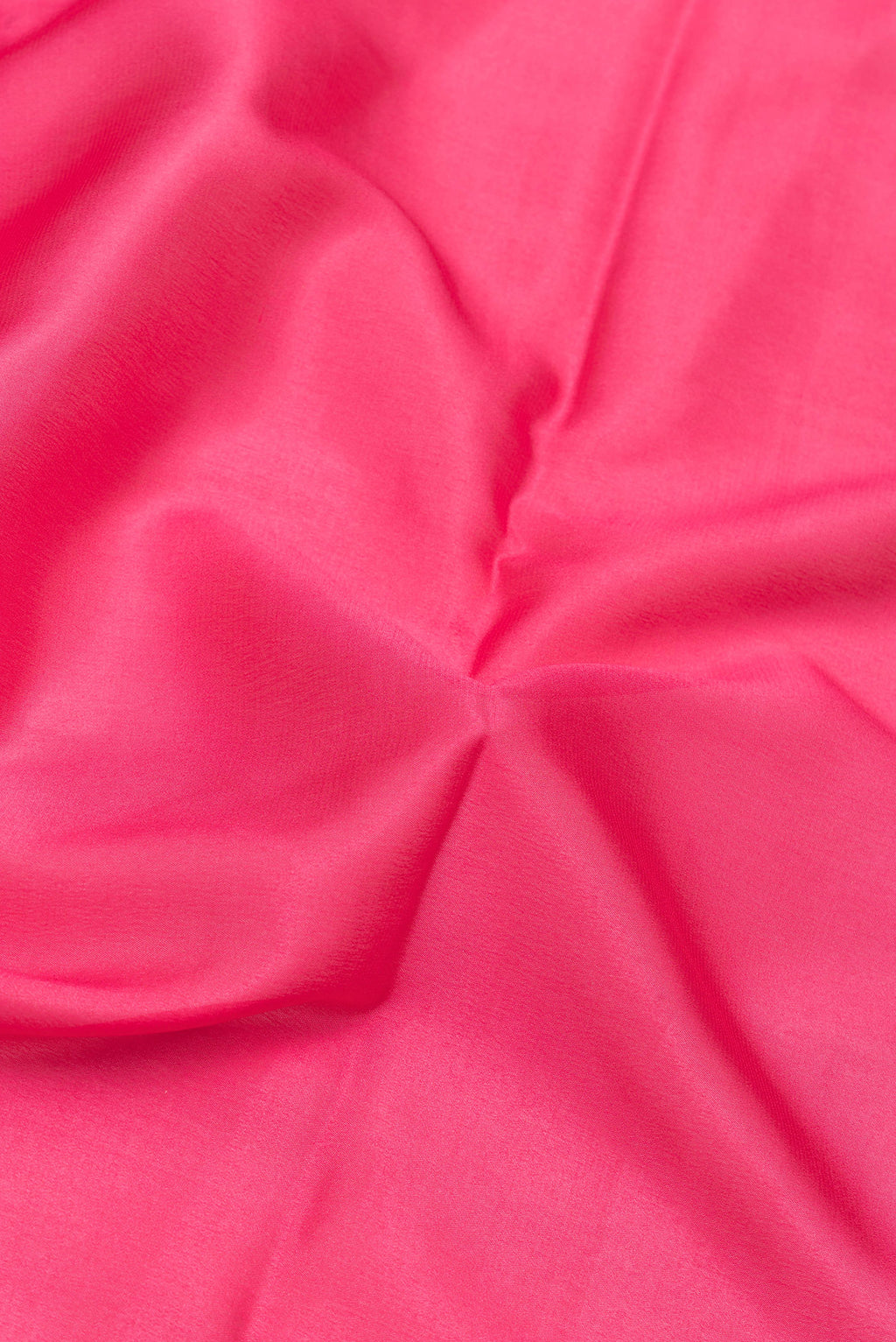 Close up of Pink Mysore Silk Saree with Plain Body and Zari Border.  displaying folds