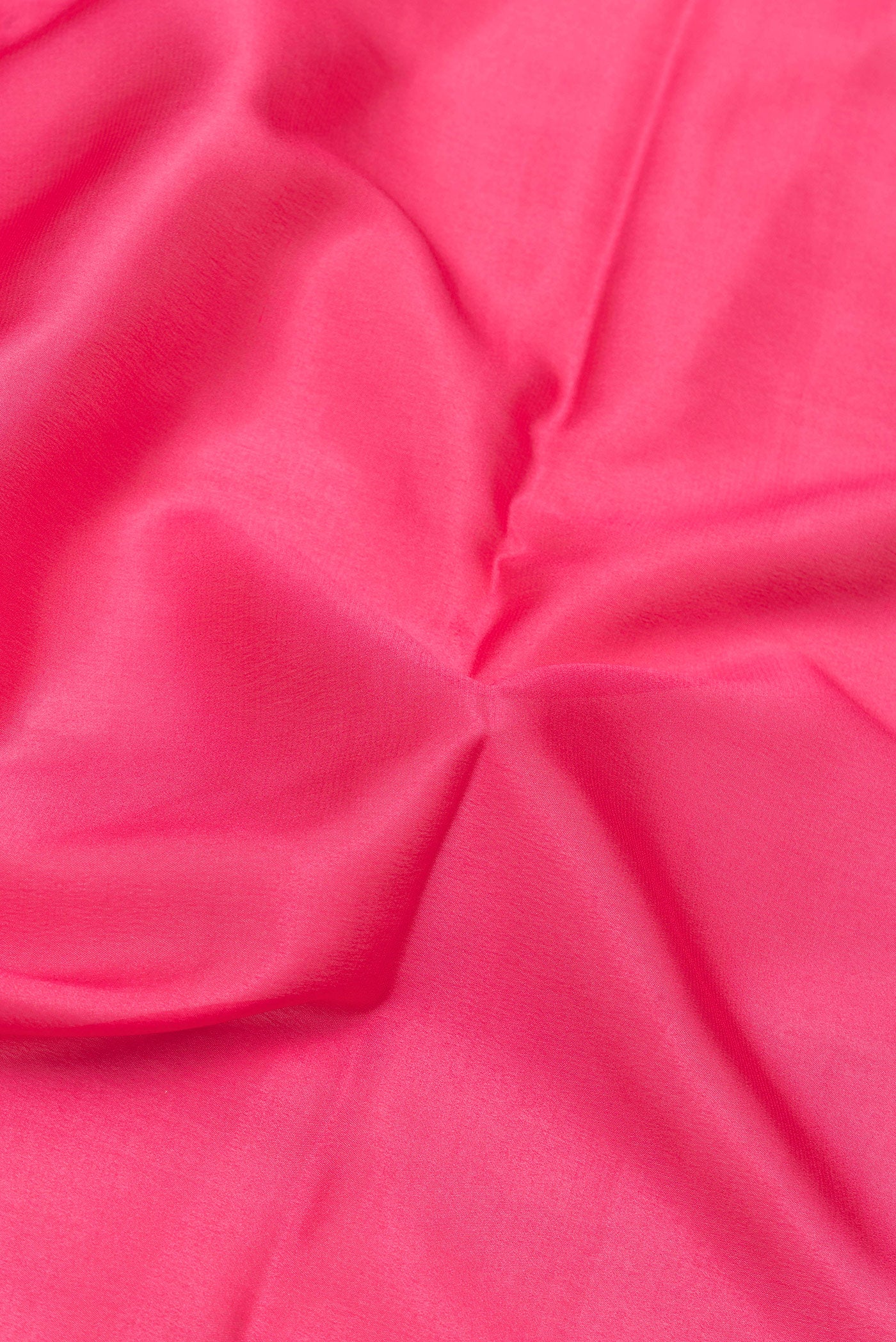 Close up of Pink Mysore Silk Saree with Plain Body and Zari Border.  displaying folds