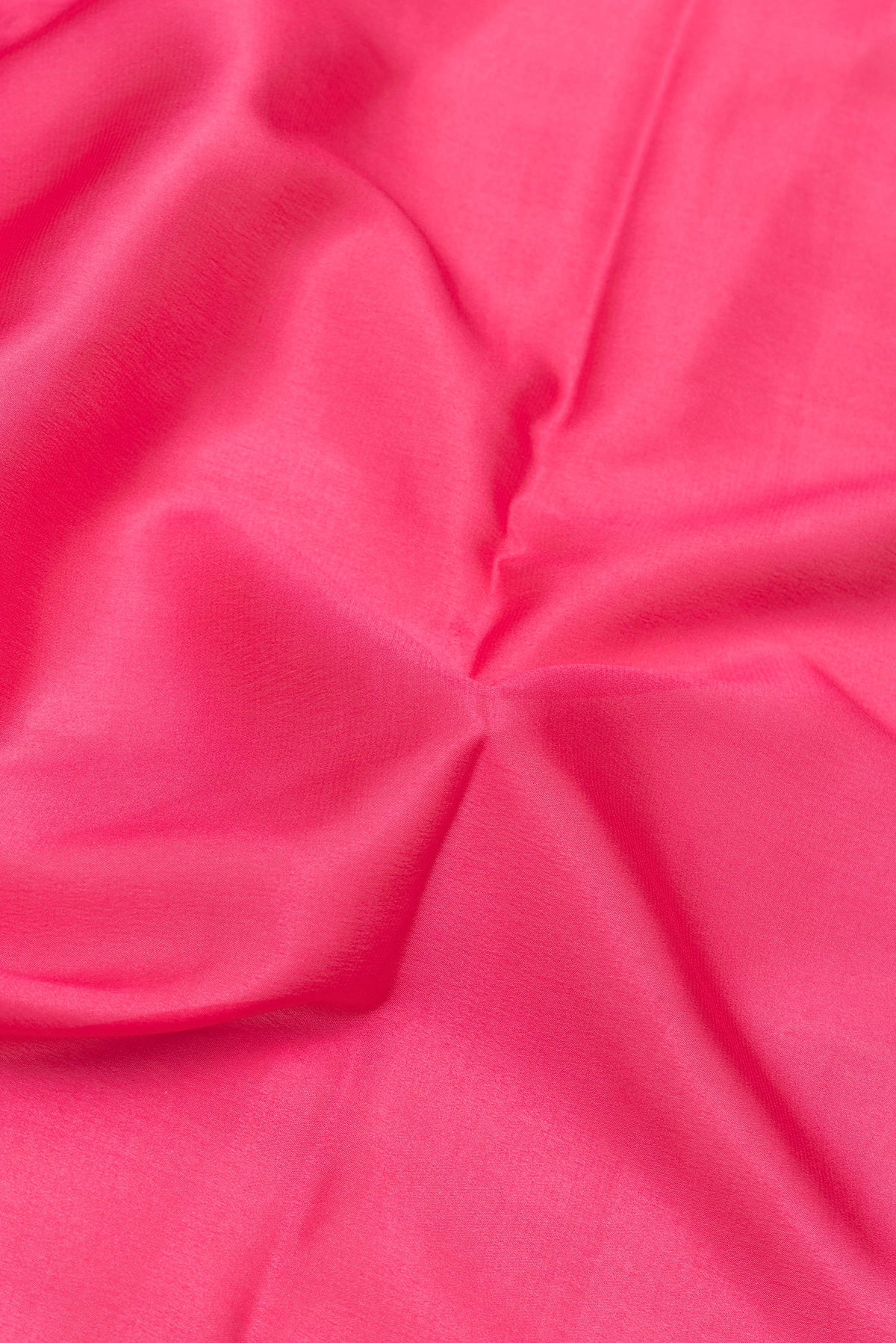 Close up of Pink Mysore Silk Saree with Plain Body and Zari Border.  displaying folds