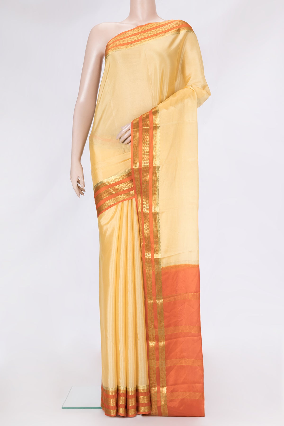 Sandal Dual Tone Mysore Silk Saree with Plain Body and Zari Border.  displayed on a mannequin