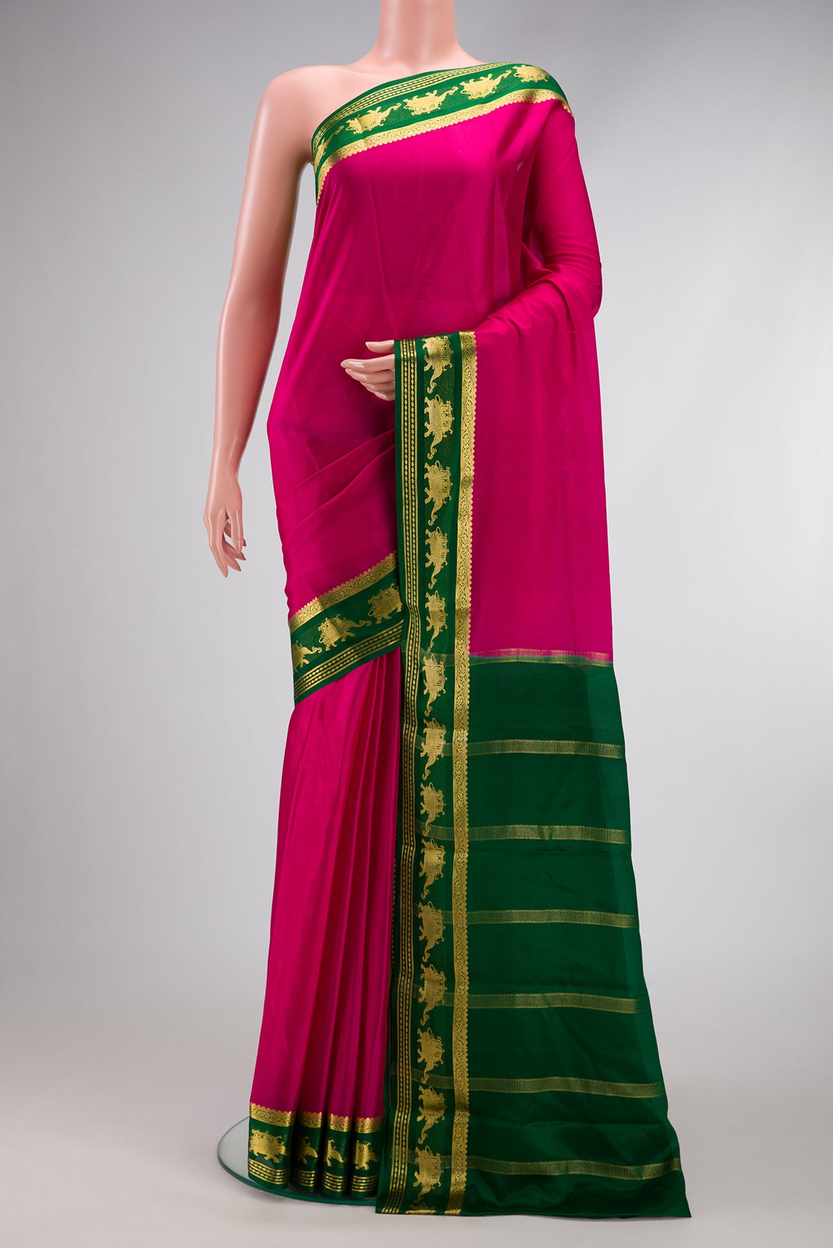 Magenta Dual Tone Mysore Silk Saree with Plain Body and Fancy Border.  displayed on a mannequin