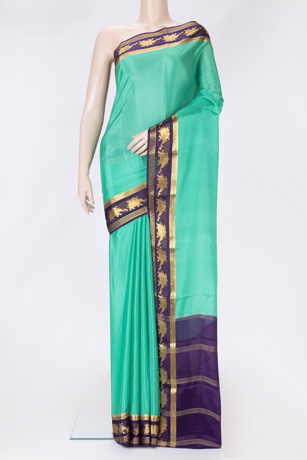 Sea Green Dual Tone Mysore Crepe Saree with Plain Body and Zari Border.  displayed on a mannequin