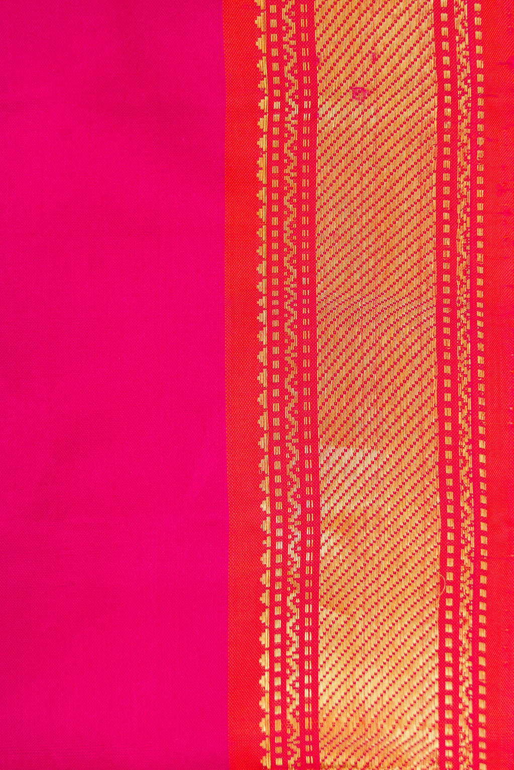 Border image of Magenta Dual Tone Kanjivaram Silk Saree with Plain Body and Zari Border. 