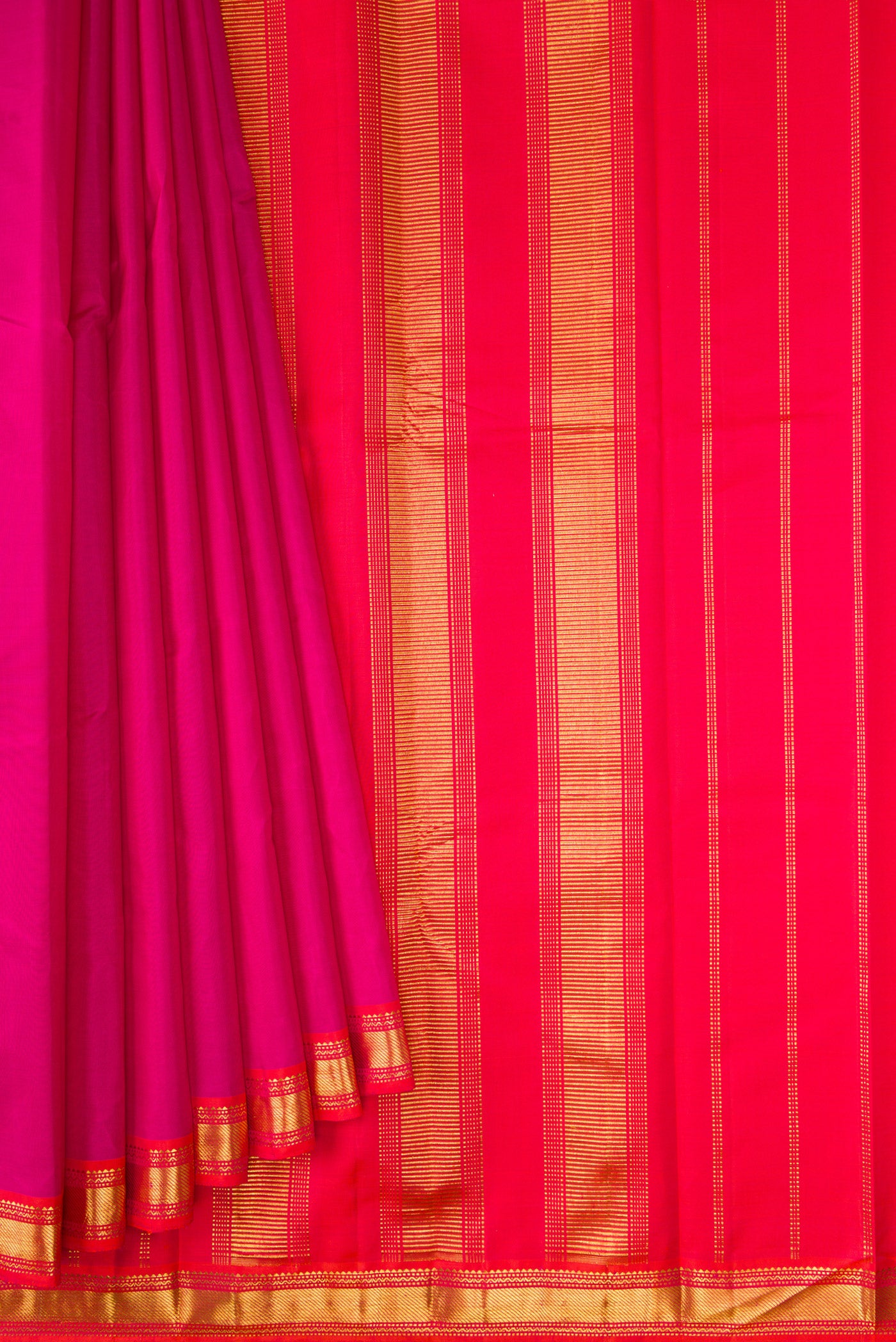 Pleats and pallu of Magenta Dual Tone Kanjivaram Silk Saree with Plain Body and Zari Border. 
