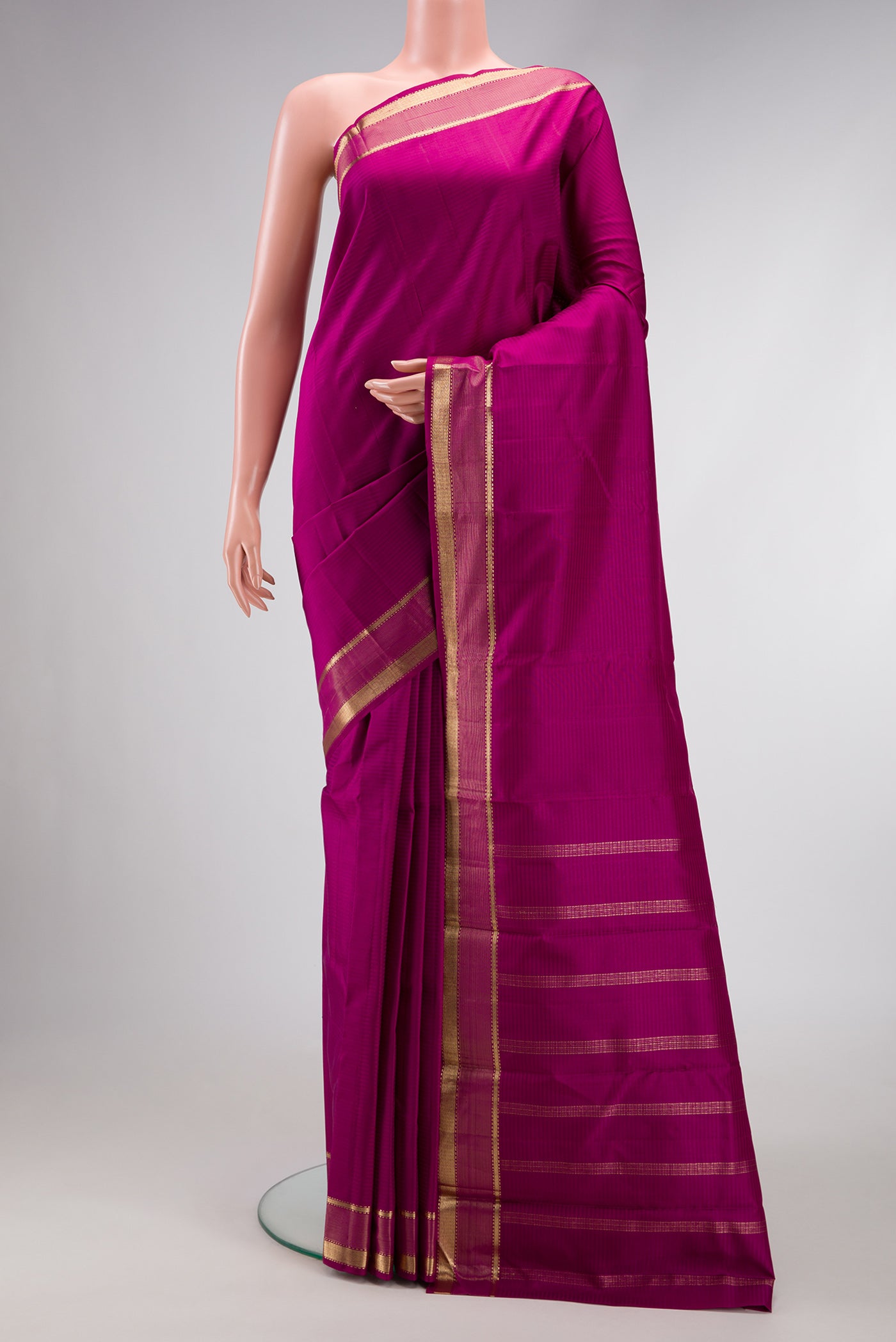 Purple Dual Tone Kanjivaram Silk Saree with Stripes on the body and Zari Border.  displayed on a mannequin