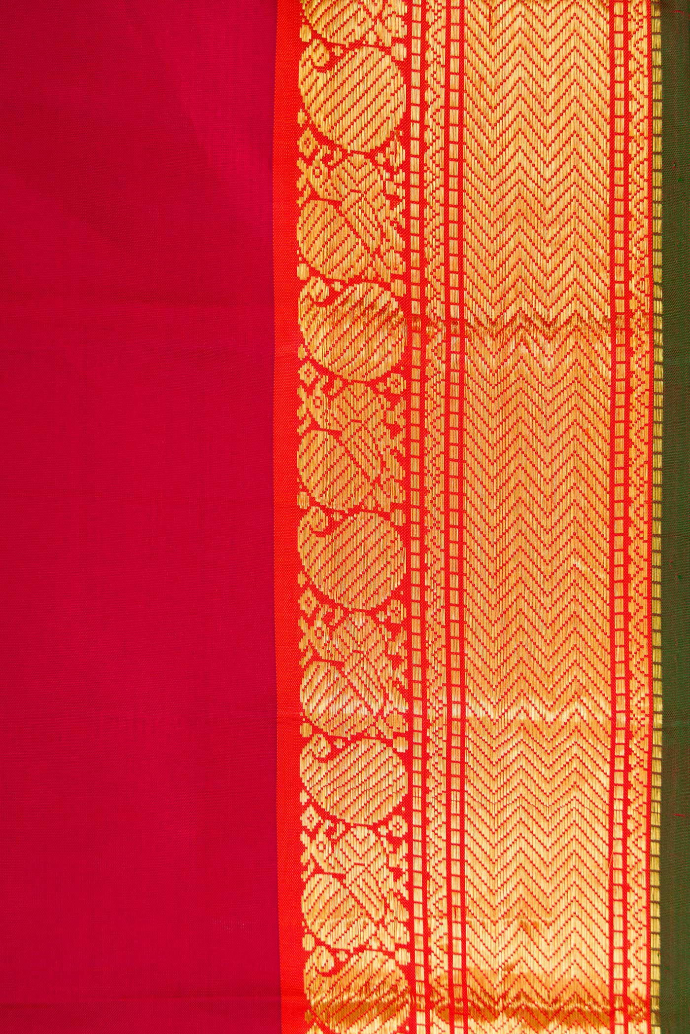 Border image of Maroon Dual Tone Kanchipuram Silk Saree with Plain Body and Zari Border. 