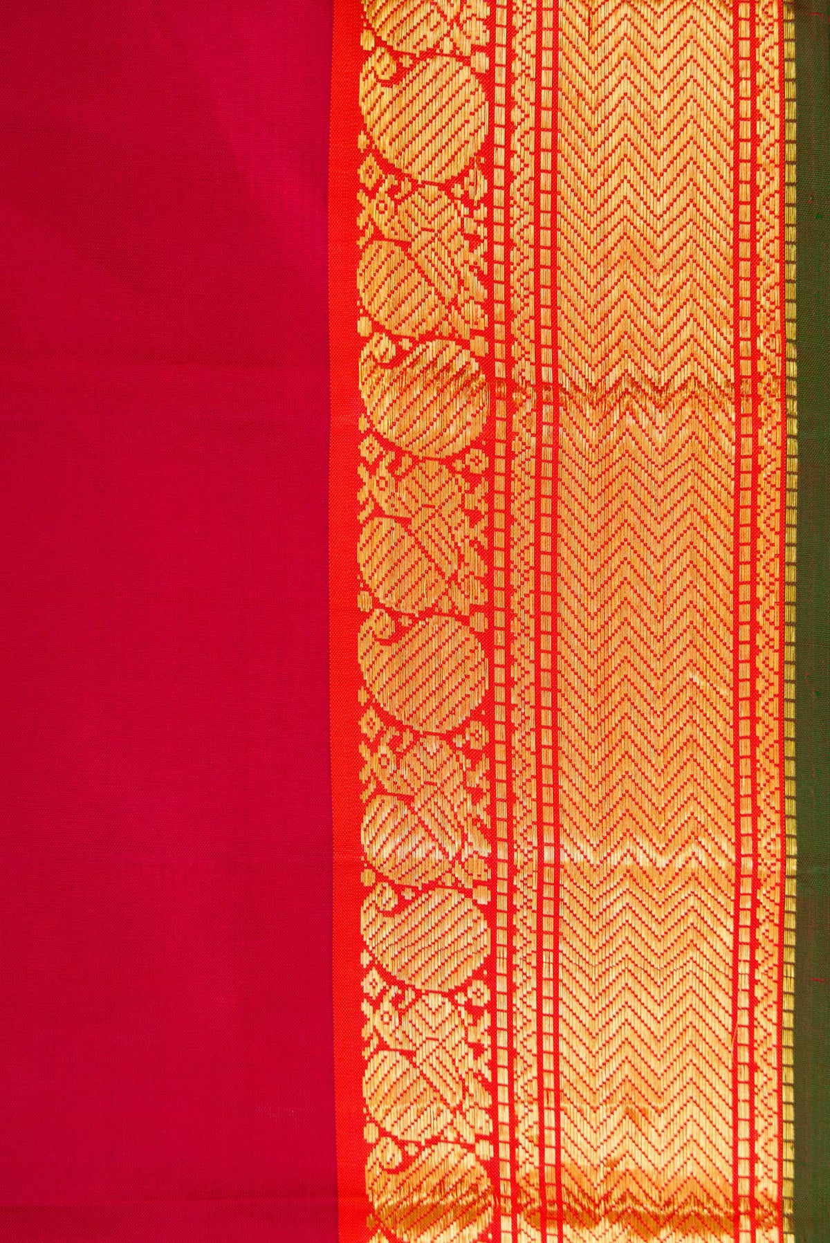 Border image of Maroon Dual Tone Kanchipuram Silk Saree with Plain Body and Zari Border. 
