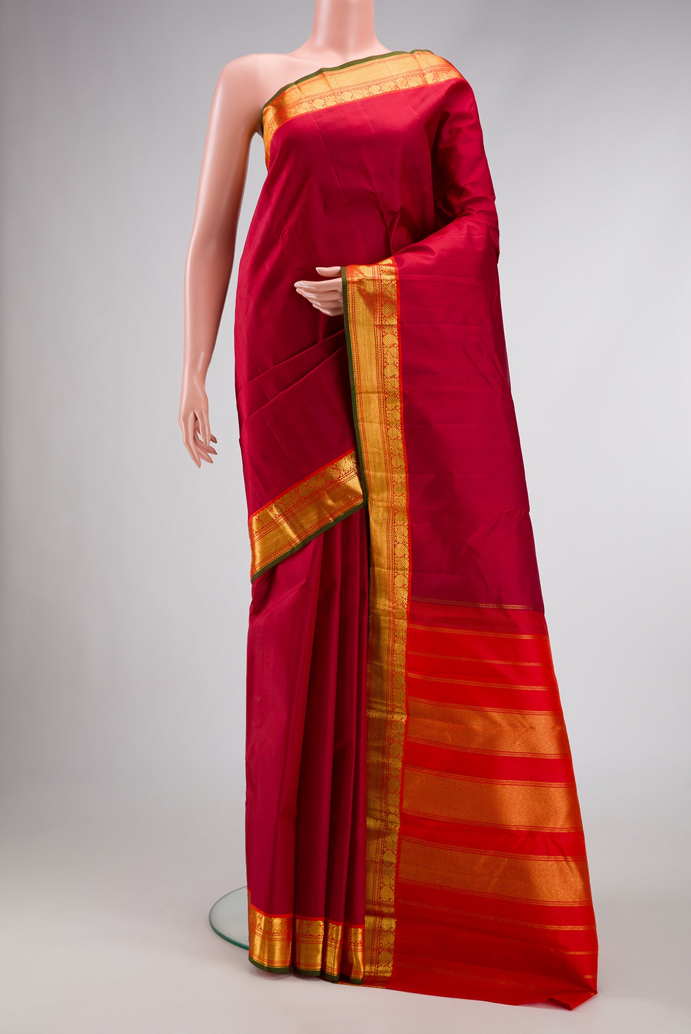 Maroon Dual Tone Kanchipuram Silk Saree with Plain Body and Zari Border.  displayed on a mannequin