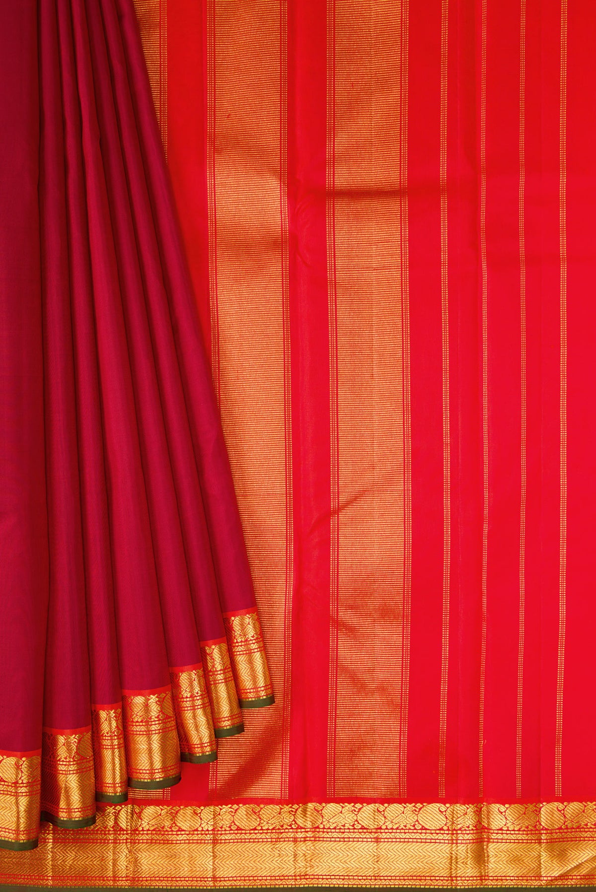 Pleats and pallu of Maroon Dual Tone Kanchipuram Silk Saree with Plain Body and Zari Border. 