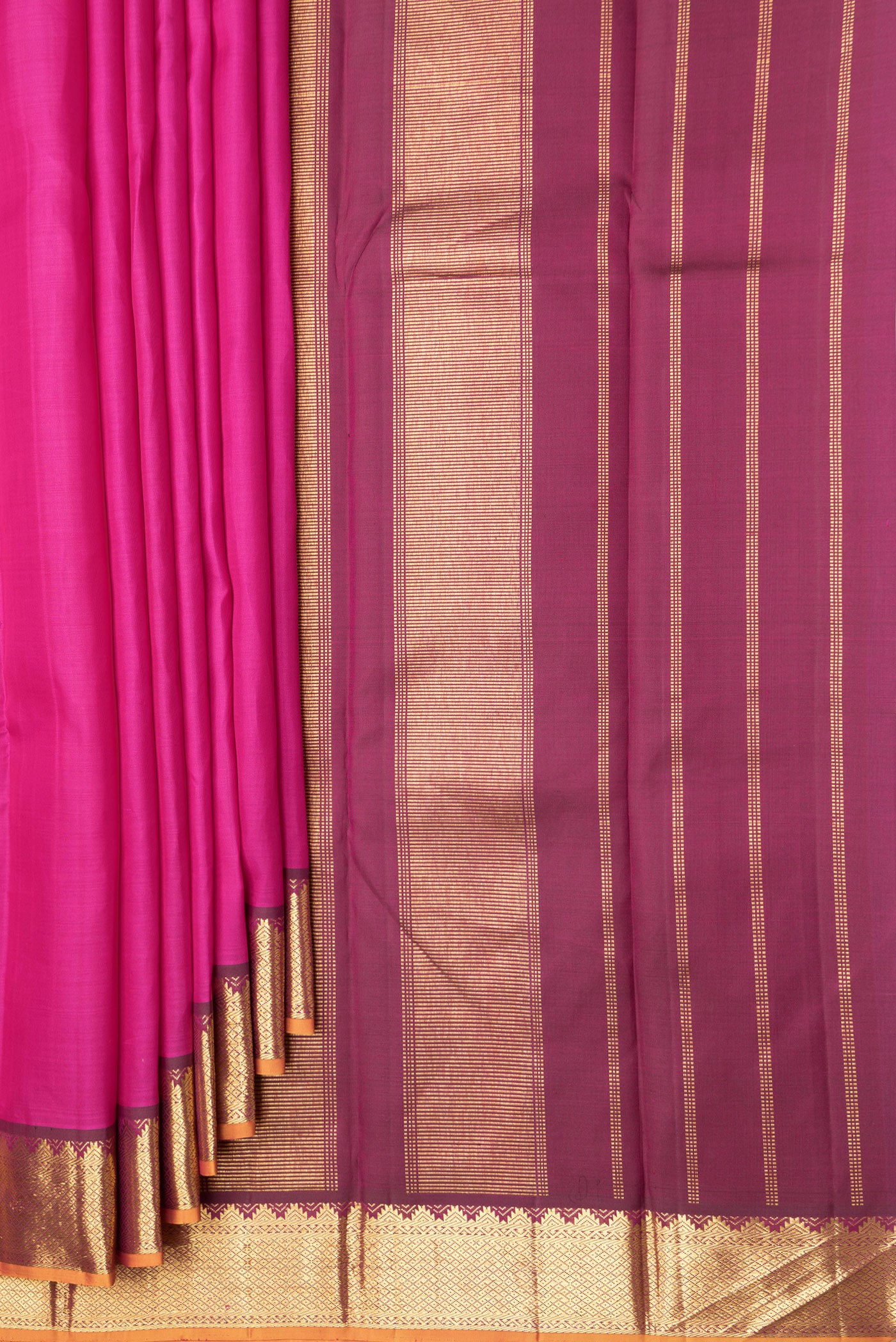 Pleats and pallu of Pink Dual Tone Kanchipuram Silk Saree with Plain Body and Zari Border. 