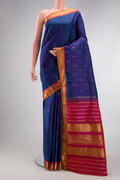 Peacock Blue Dual Tone Kanchipuram Silk Saree with Zari Butta on the body and Zari Border.  displayed on a mannequin