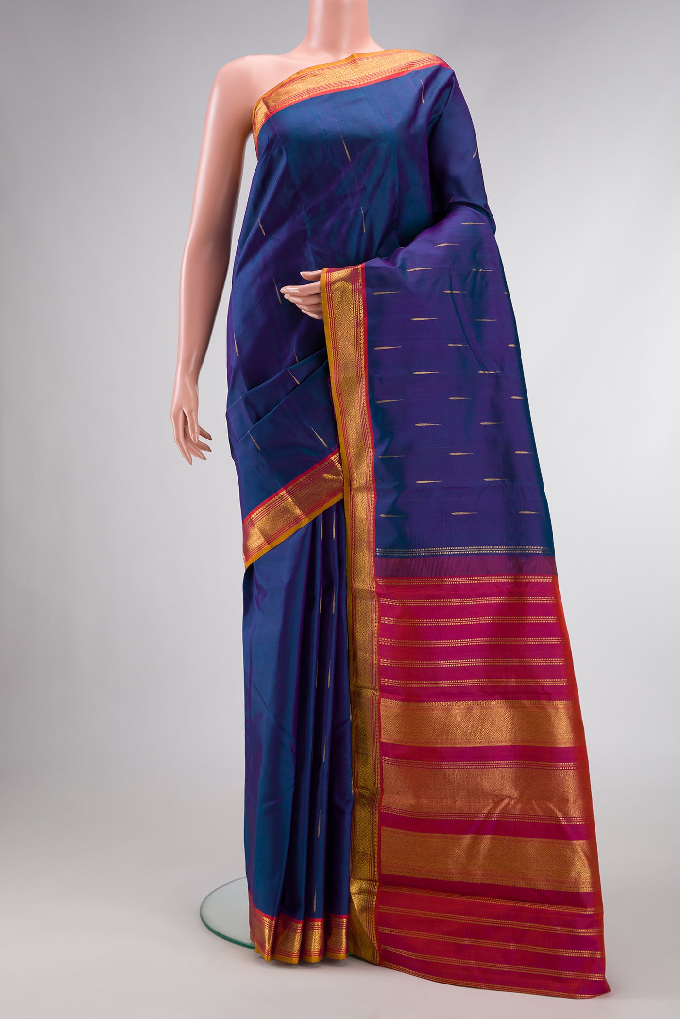 Peacock Blue Dual Tone Kanchipuram Silk Saree with Zari Butta on the body and Zari Border.  displayed on a mannequin