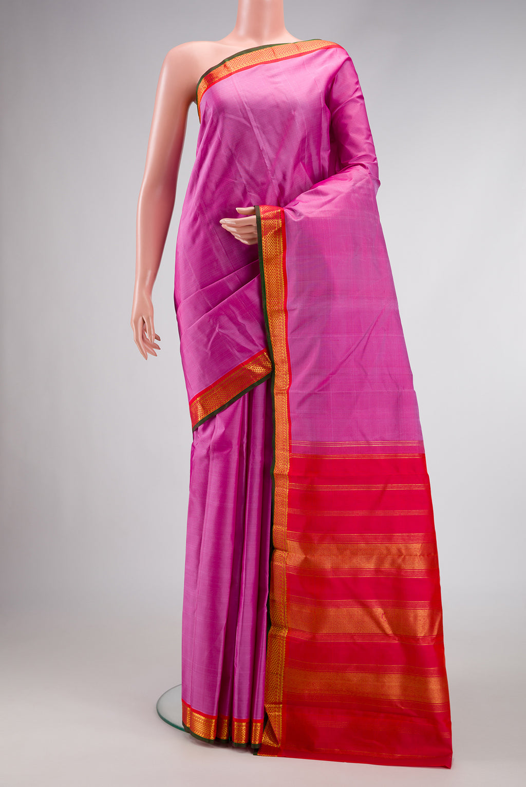 Pink Dual Tone Kanjivaram Silk Saree with Plain Body and Zari Border.  displayed on a mannequin