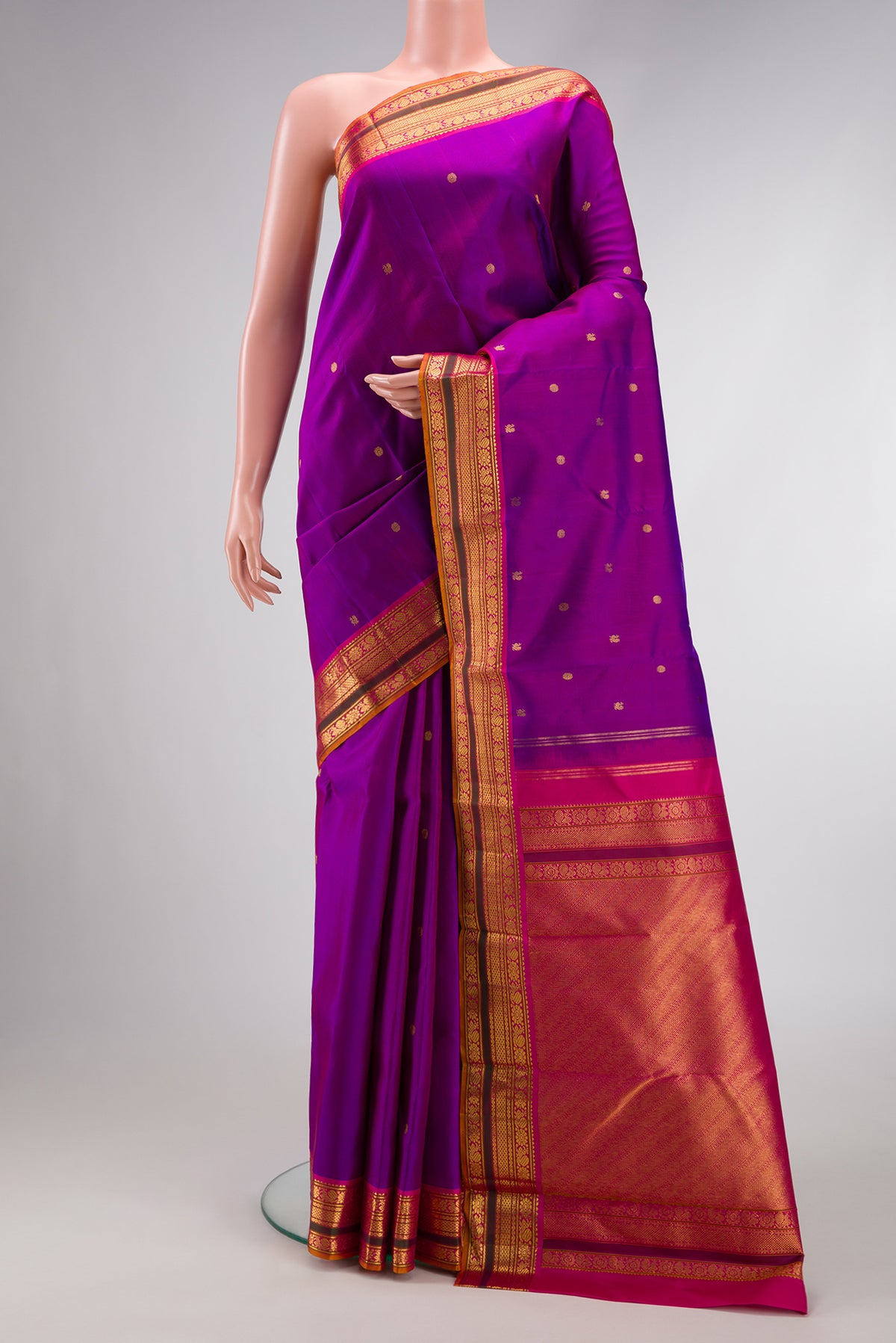 Purple Dual Tone Kanjivaram Silk Saree with Zari Butta on the body and Zari Border.  displayed on a mannequin