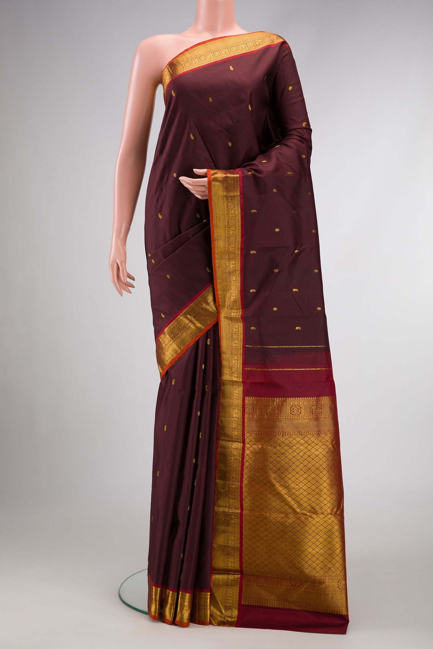 Coffee Brown Dual Tone Kanjivaram Silk Saree with Zari Butta on the body and Zari Border.  displayed on a mannequin