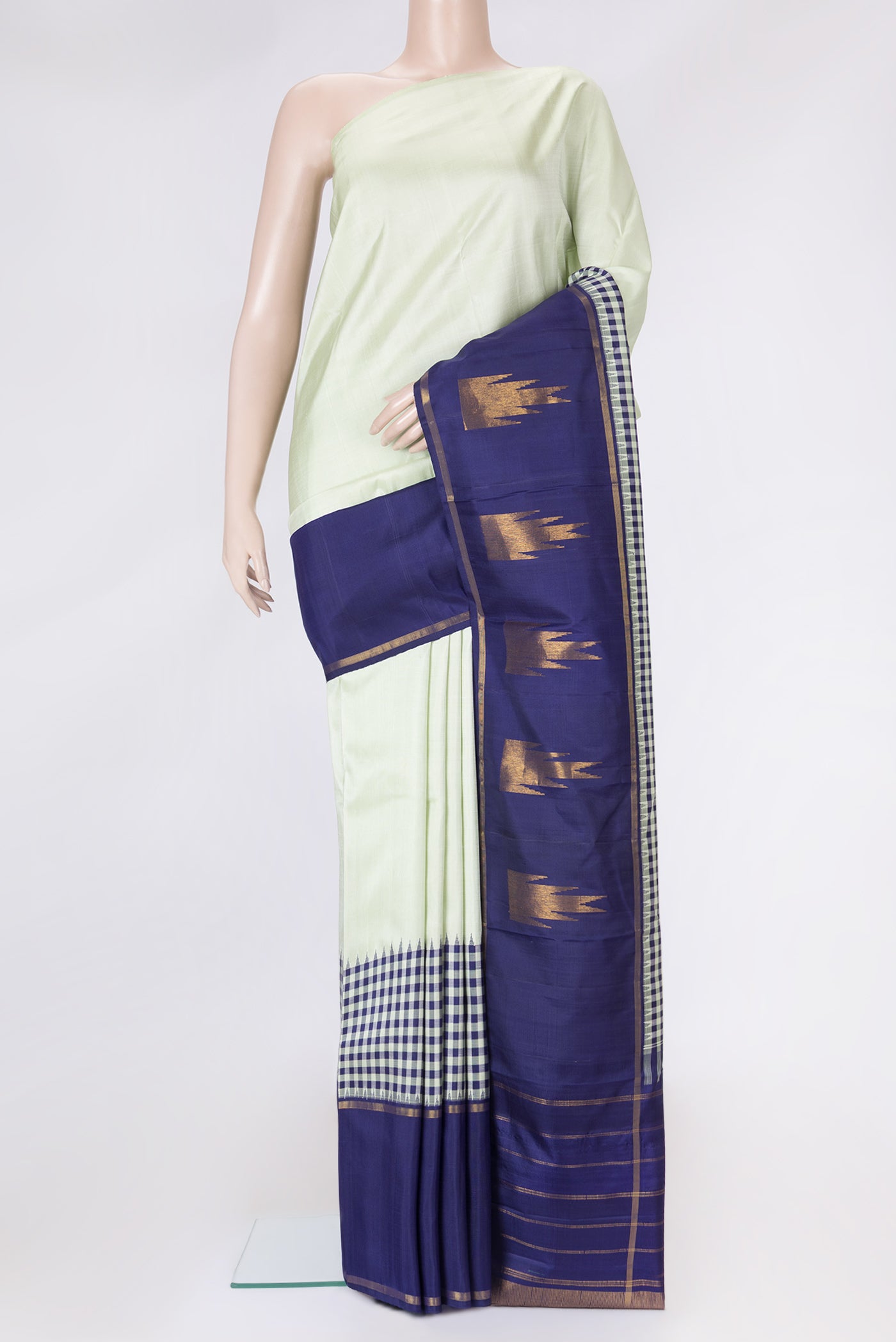 Pista Green Dual Tone Kanjivaram Silk Saree with Plain Body and Plain Border.  displayed on a mannequin