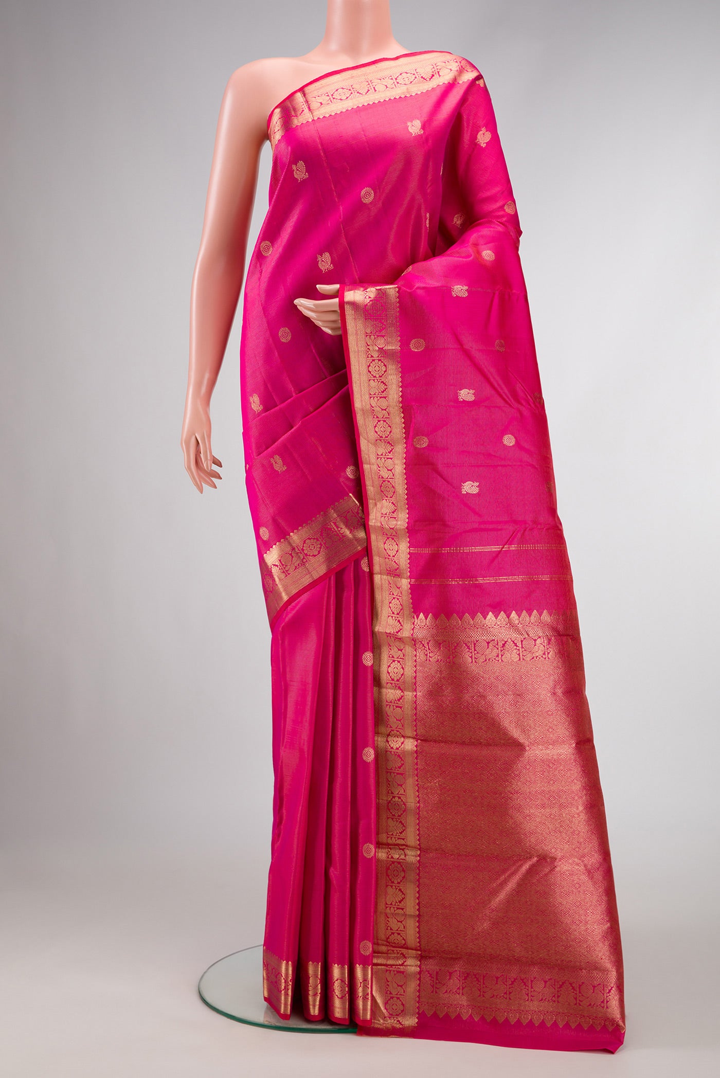 Pink Dual Tone Kanjivaram Silk Saree with Zari Butta on the body and Zari Border.  displayed on a mannequin